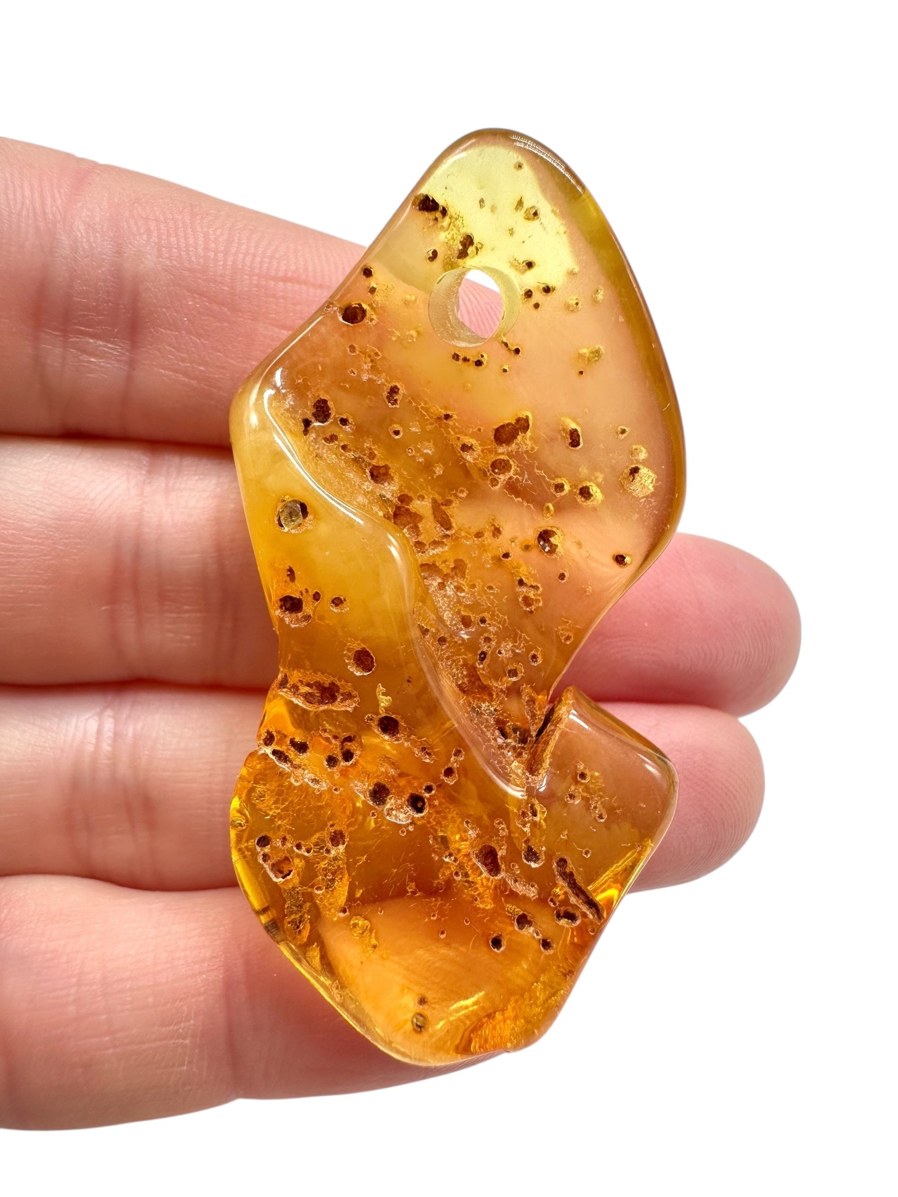 Amber with a drilled hole for hanging 6,3g – Lithuania