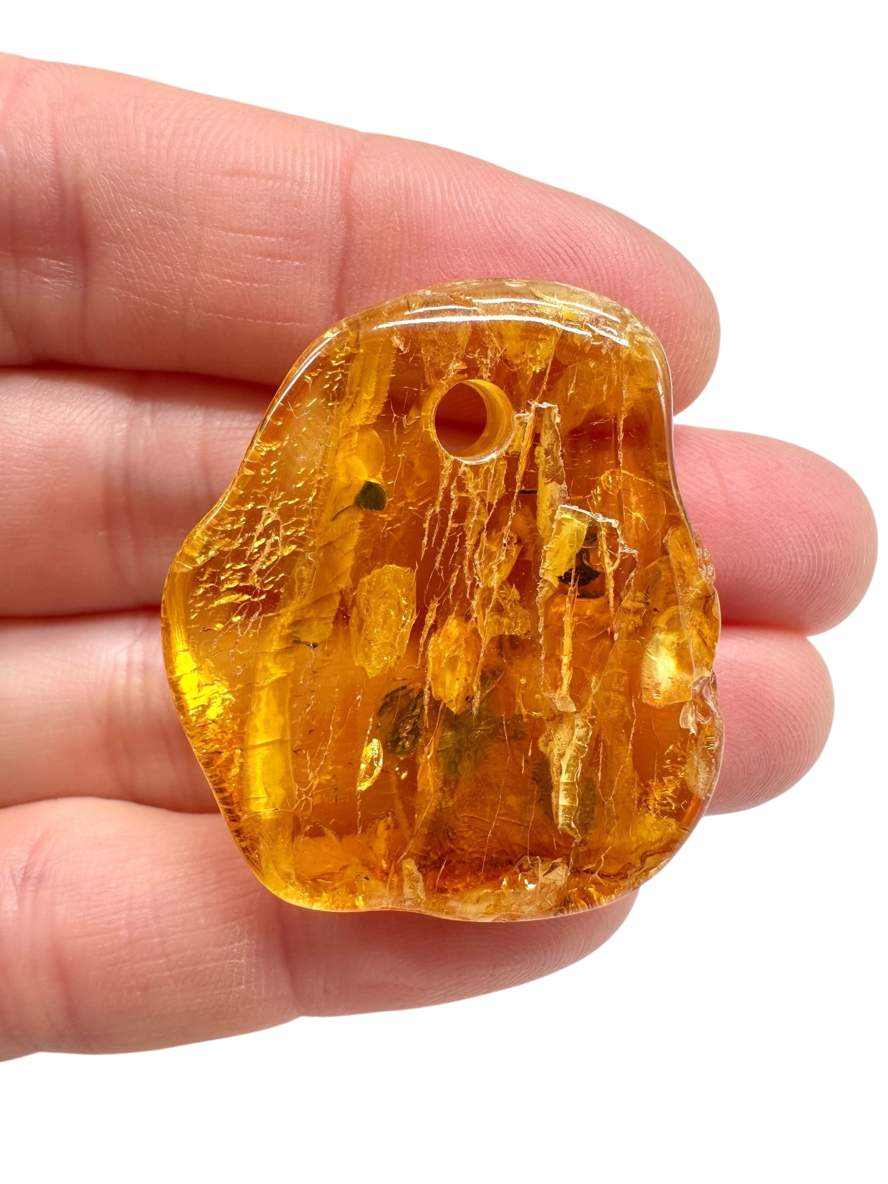Amber with a drilled hole for hanging 5g – Lithuania - JND122