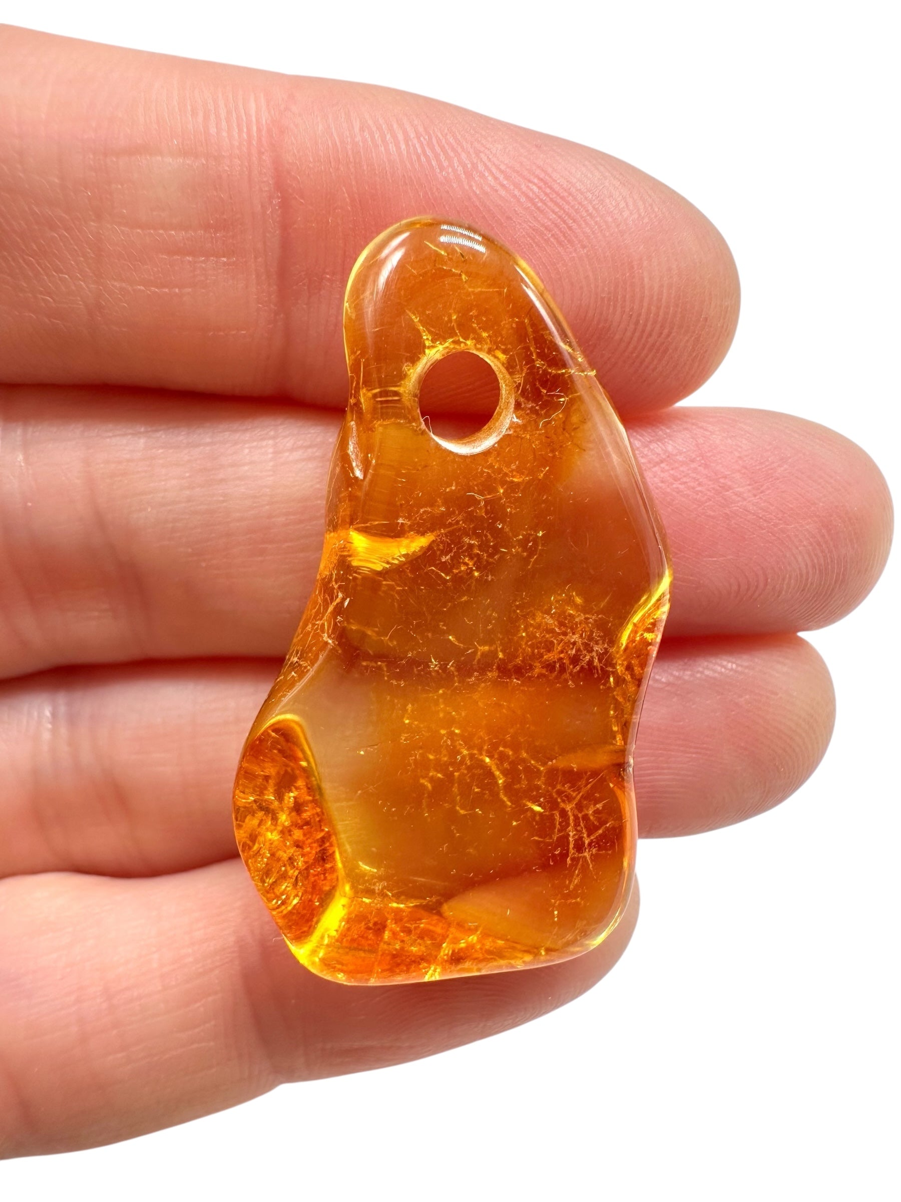Amber with a drilled hole for hanging 3,1g – Lithuania