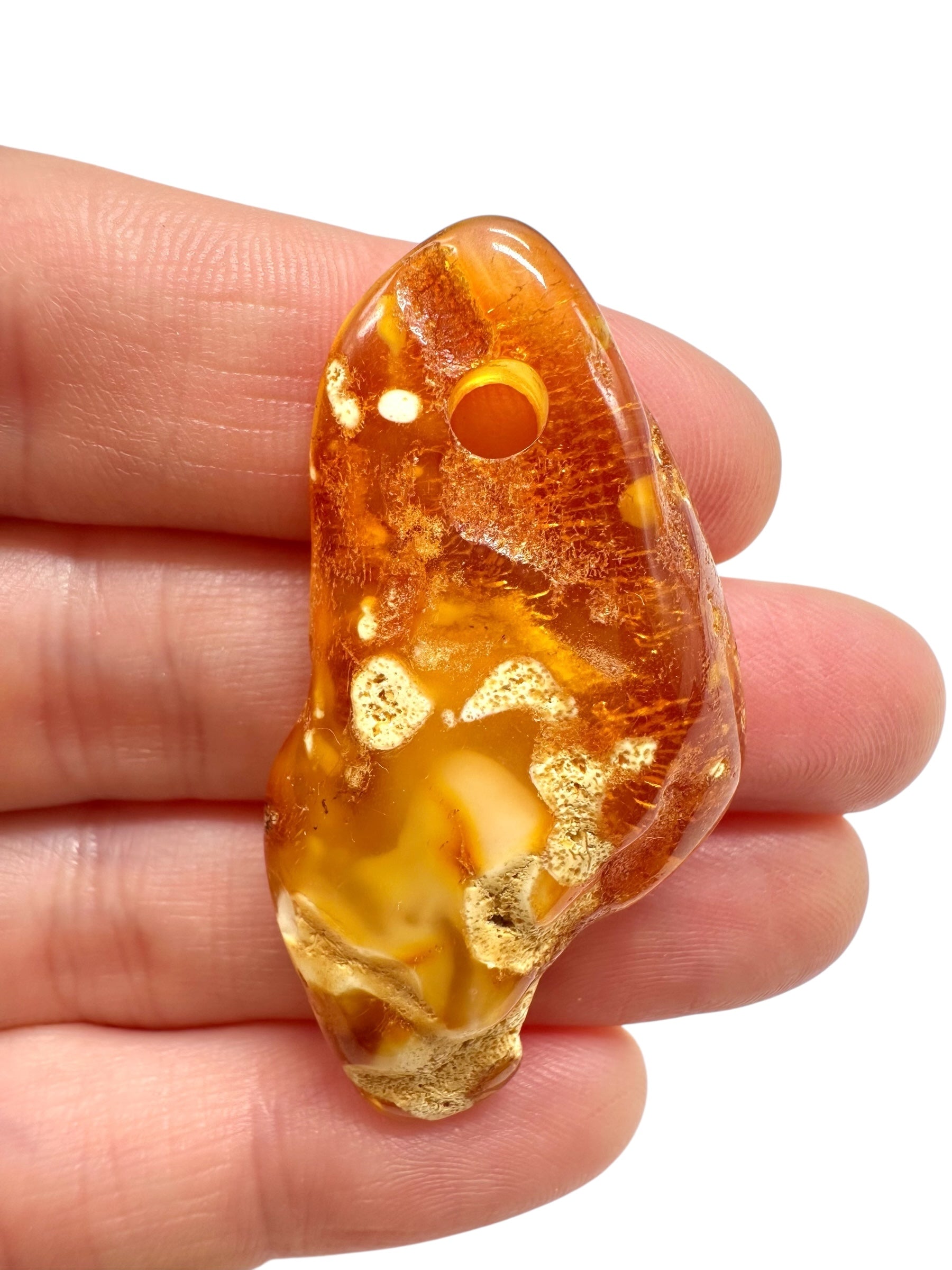 Amber with a drilled hole for hanging 3,6g – Lithuania