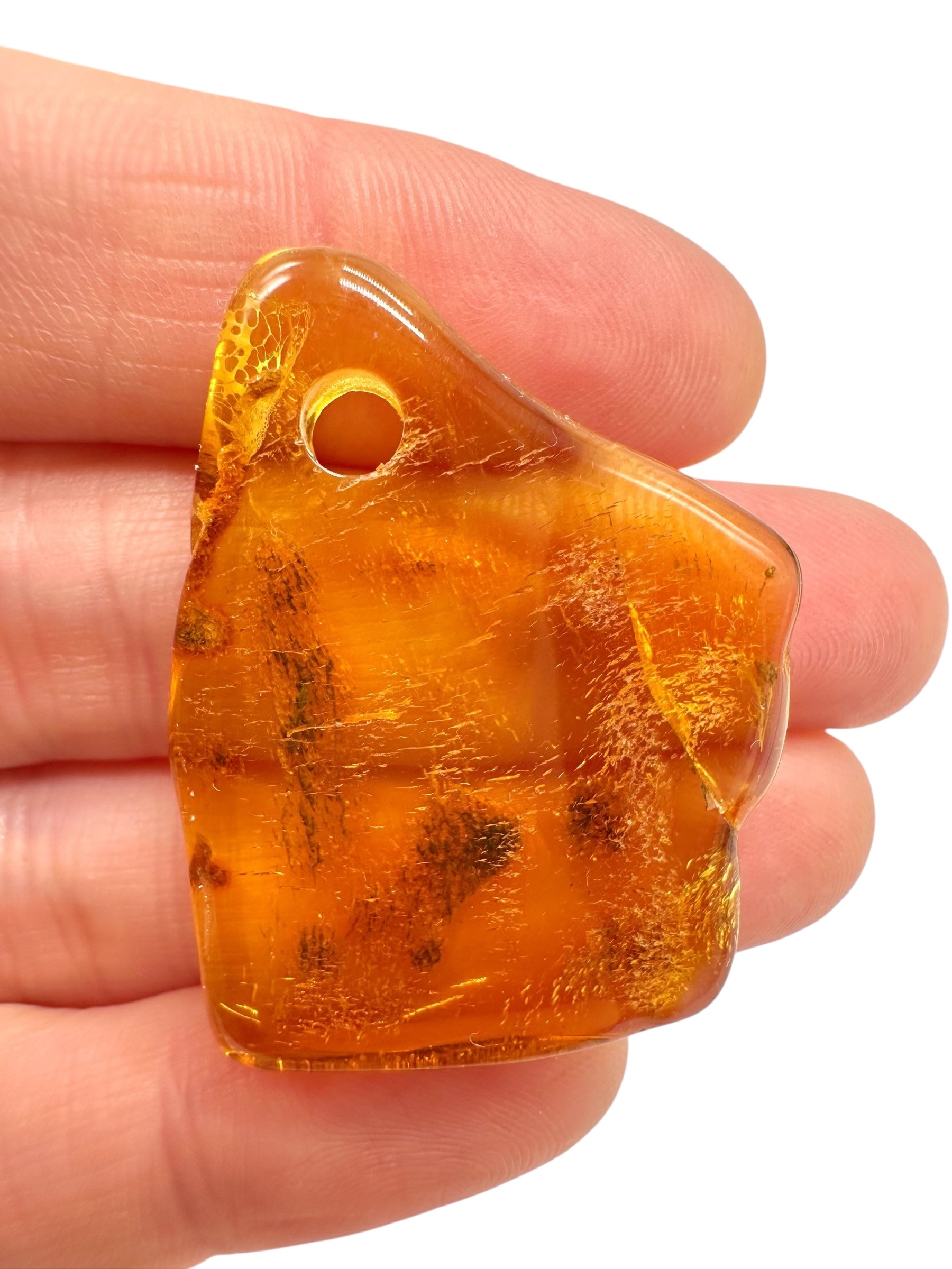 Amber with a drilled hole for hanging 4,2g – Lithuania