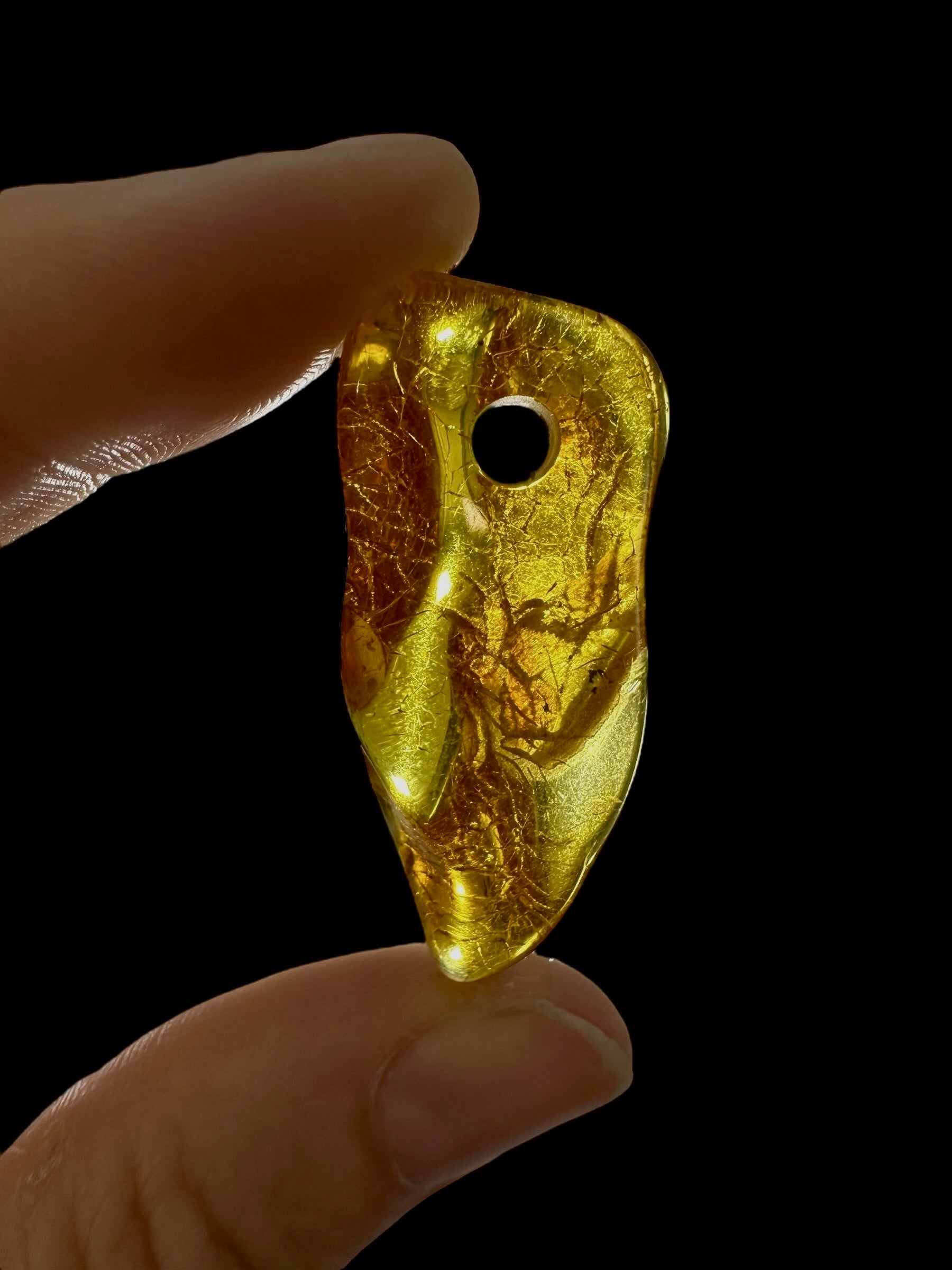 Amber with a drilled hole for hanging 2,7g – Lithuania - JND130