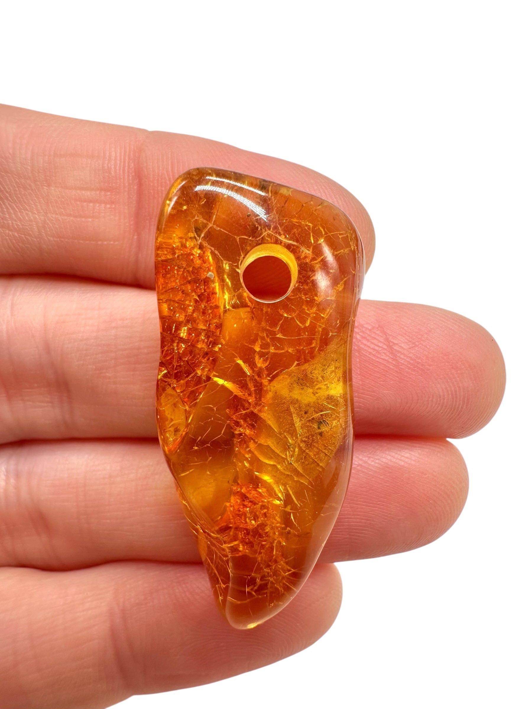 Amber with a drilled hole for hanging 2,7g – Lithuania