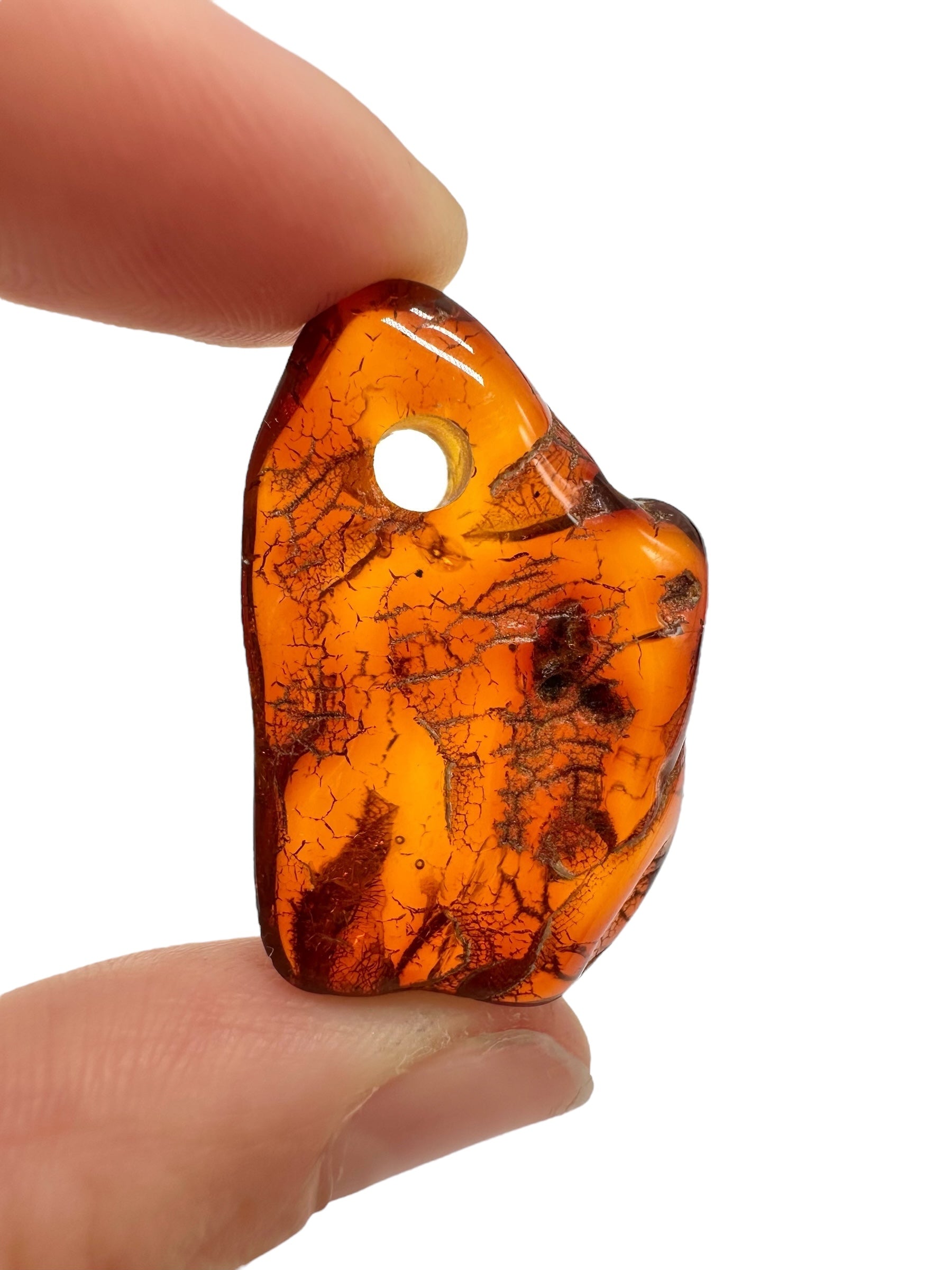 Amber with a drilled hole for hanging 3,2g – Lithuania - JND138