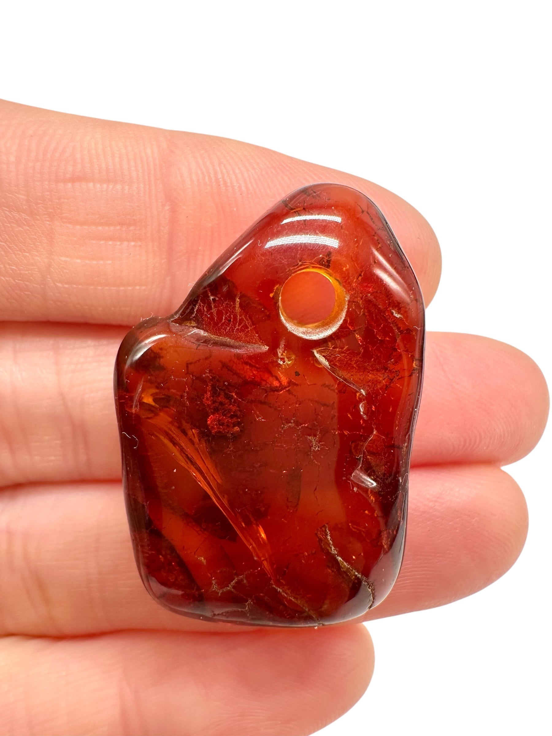 Amber with a drilled hole for hanging 3,2g – Lithuania
