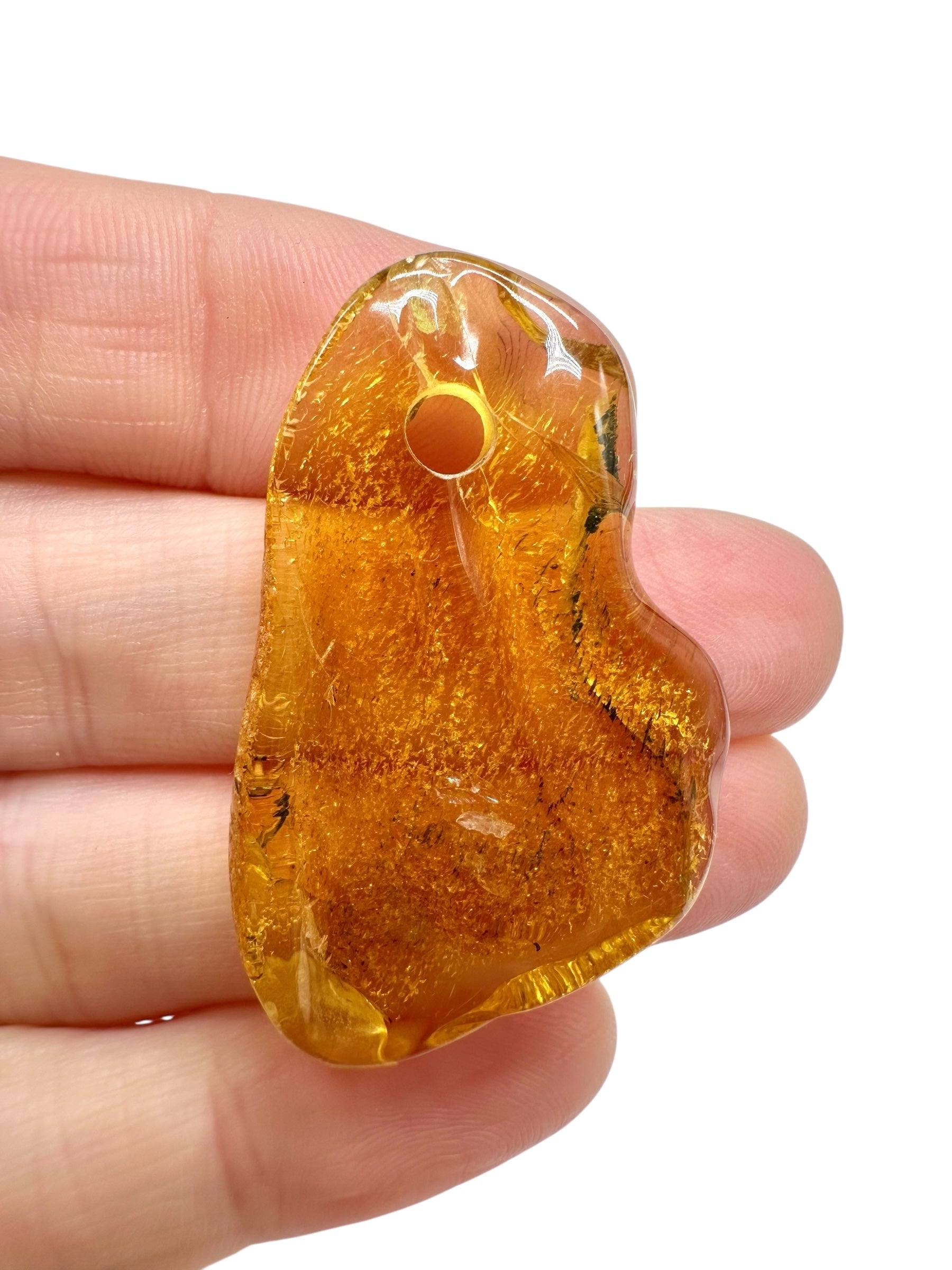 Amber with a drilled hole for hanging 2,8g – Lithuania
