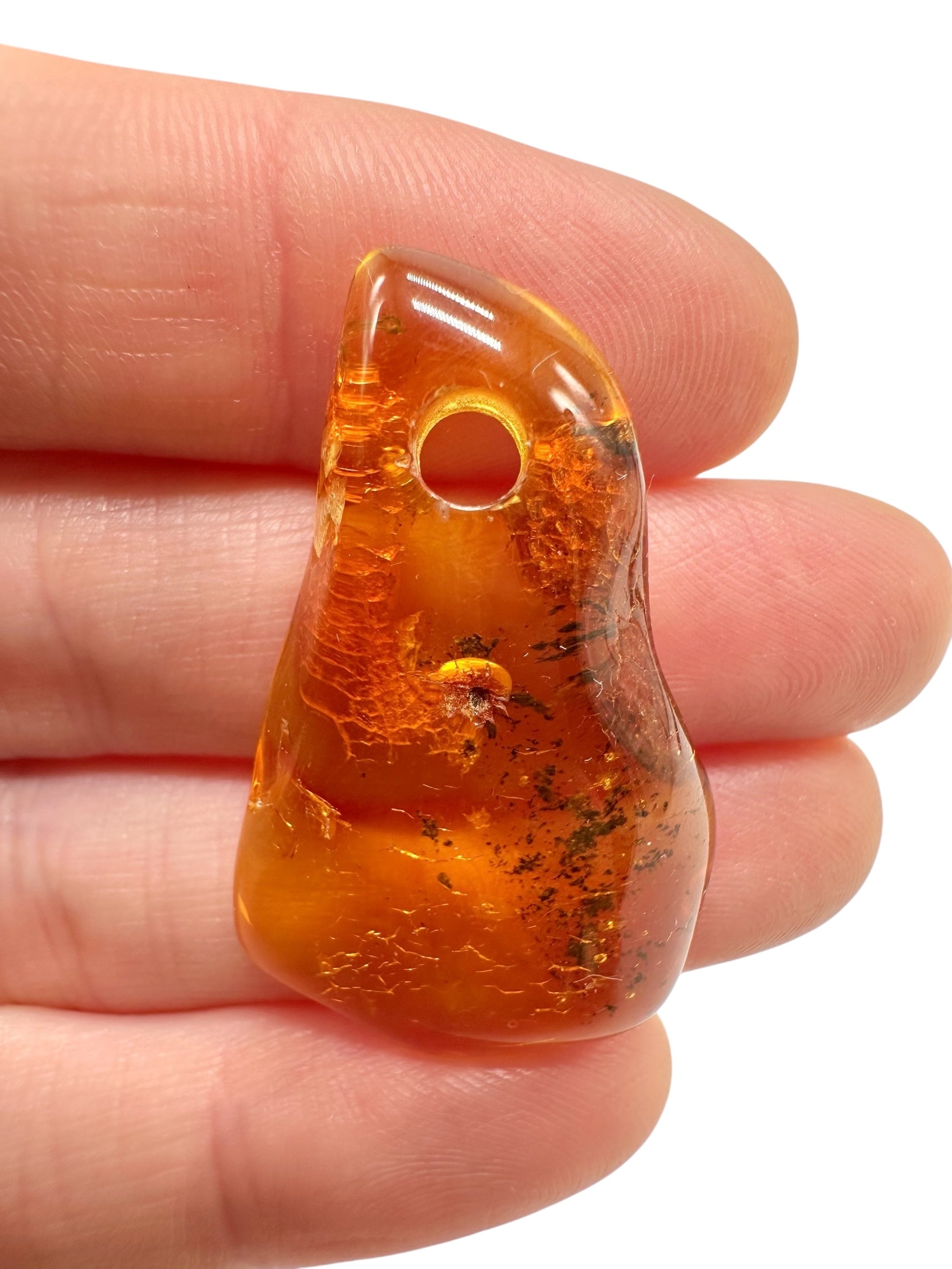 Amber with a drilled hole for hanging 2,7g – Lithuania