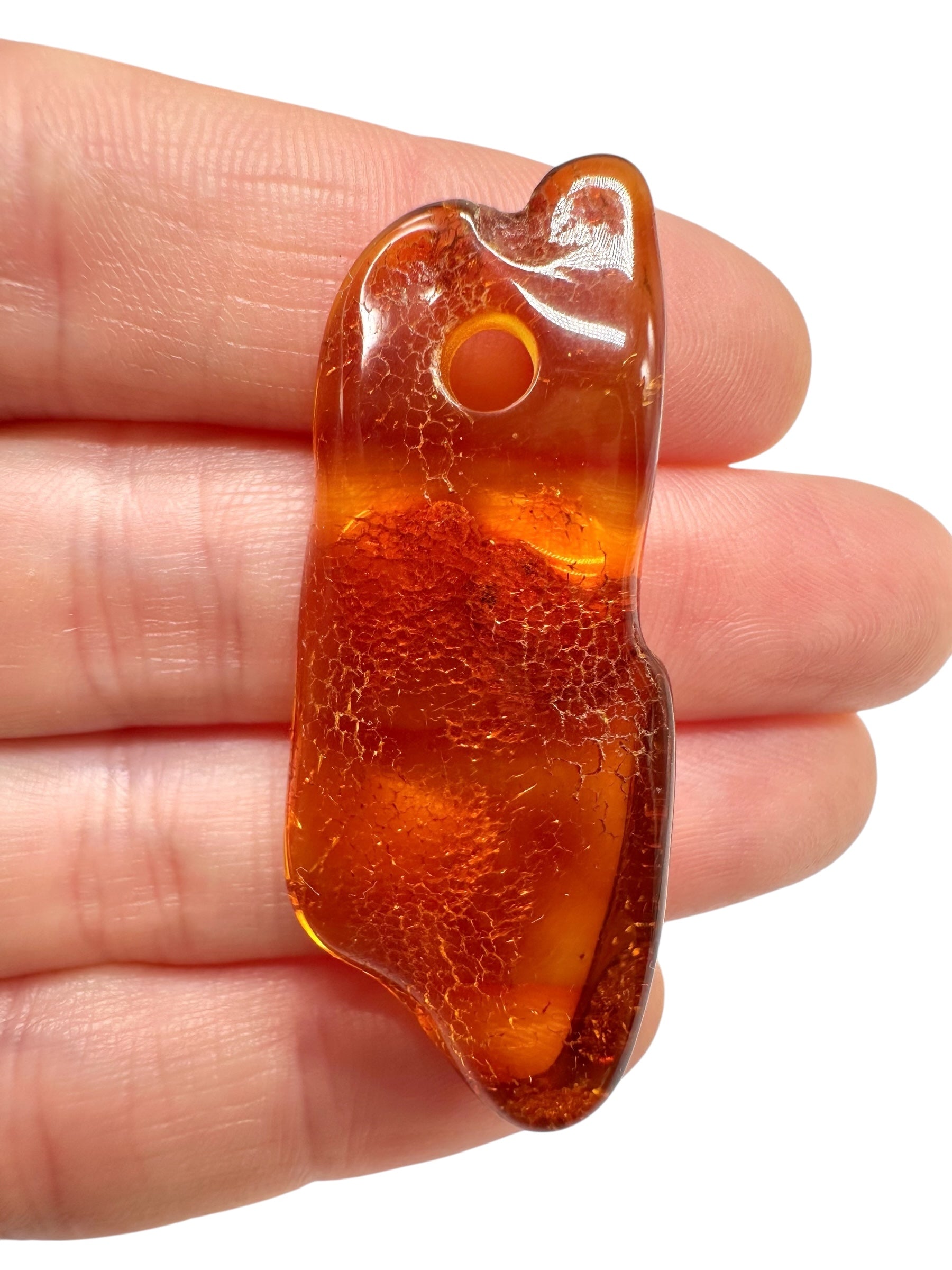 Amber with a drilled hole for hanging 3,8g – Lithuania