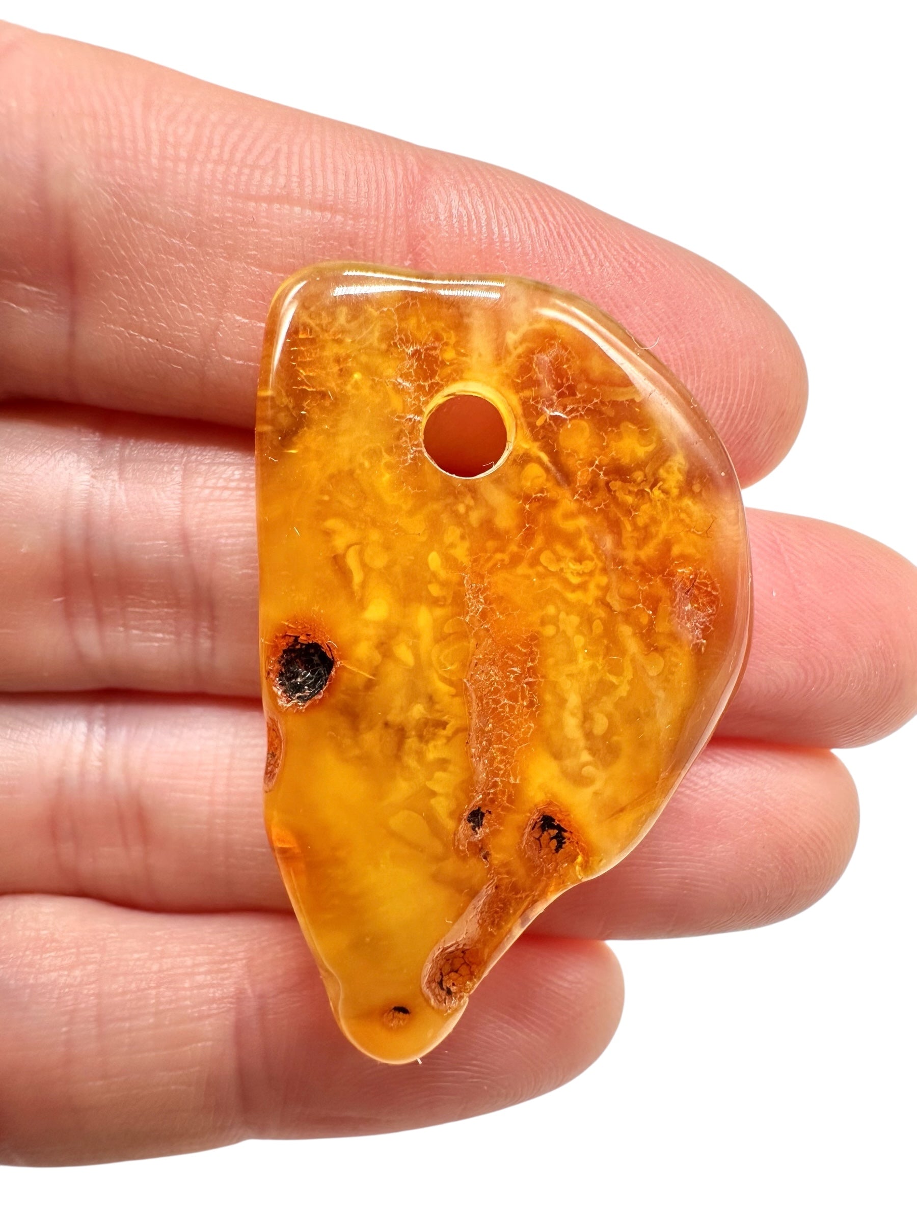 Amber with a drilled hole for hanging 3,7g – Lithuania