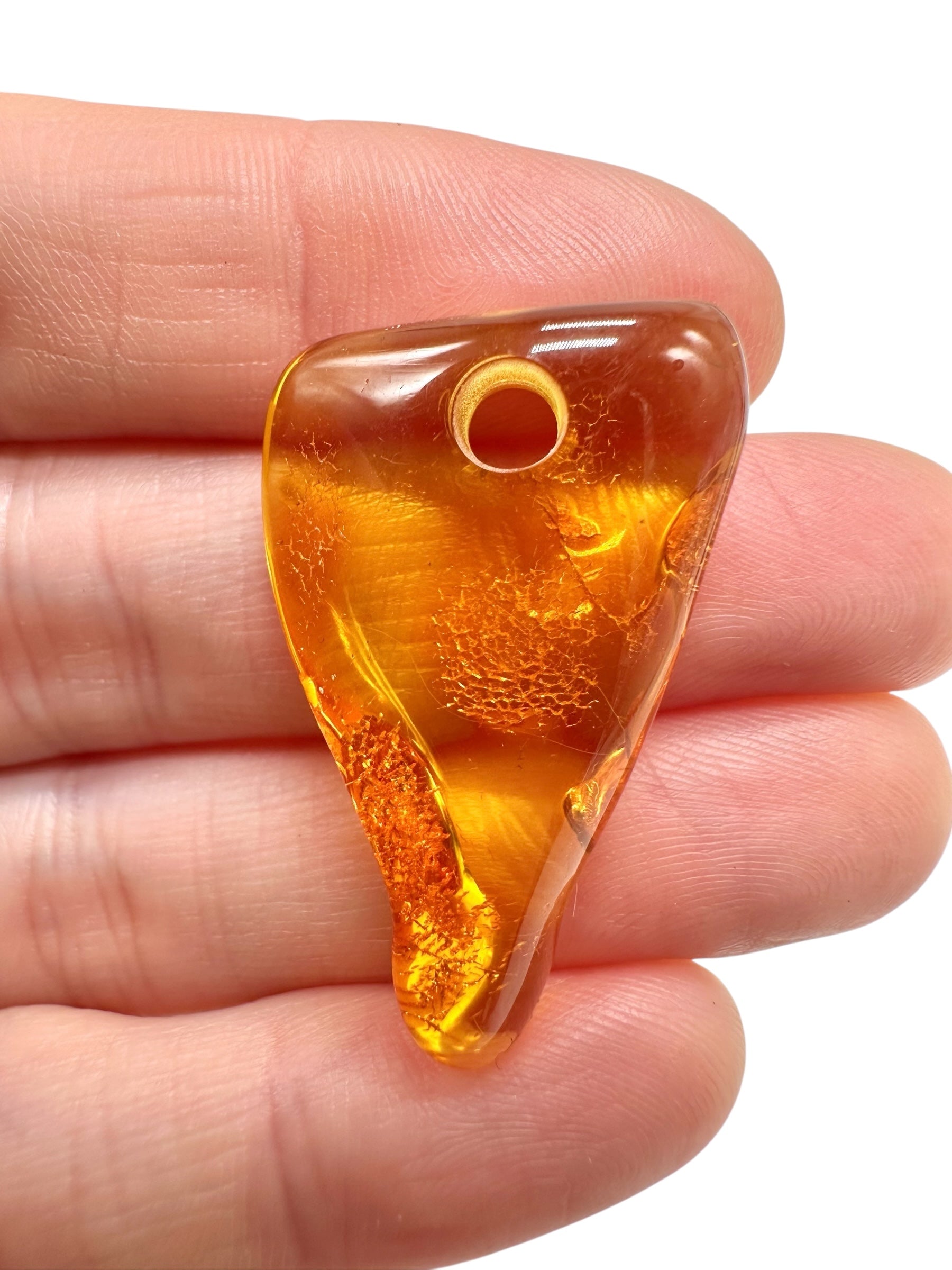 Amber with a drilled hole for hanging 2,4g – Lithuania