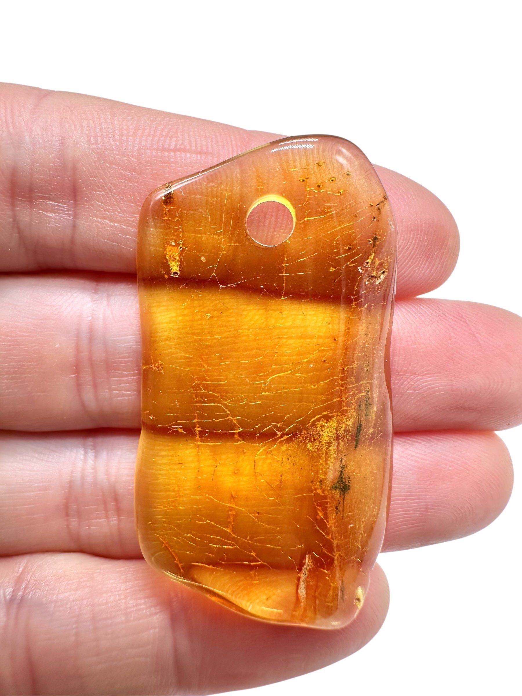 Amber with a drilled hole for hanging 3,1g – Lithuania