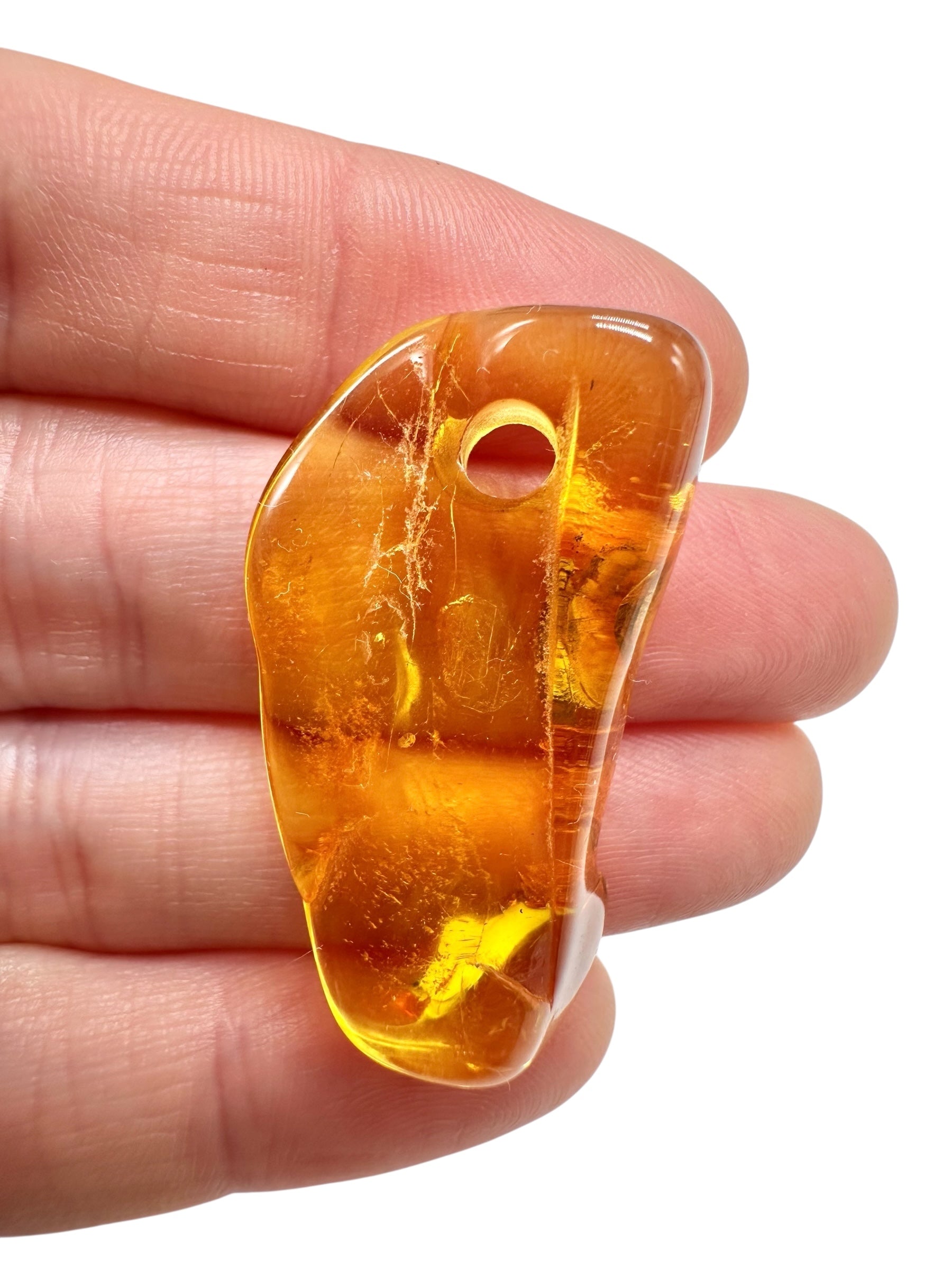 Amber with a drilled hole for hanging 2,9g – Lithuania