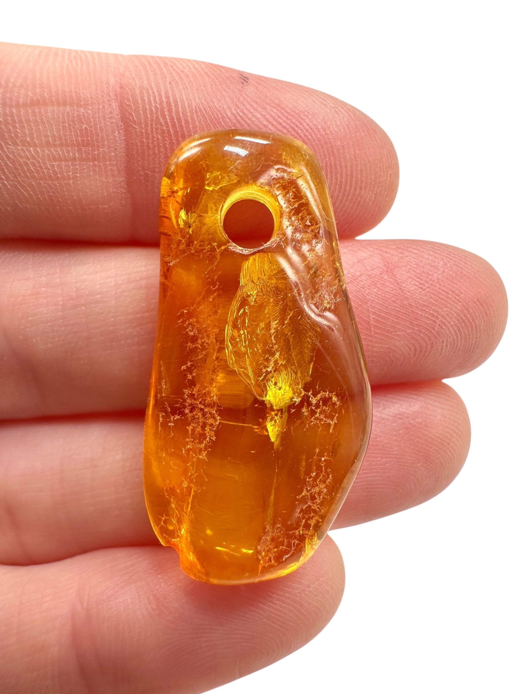 Amber with a drilled hole for hanging 2,3g – Lithuania - JND151