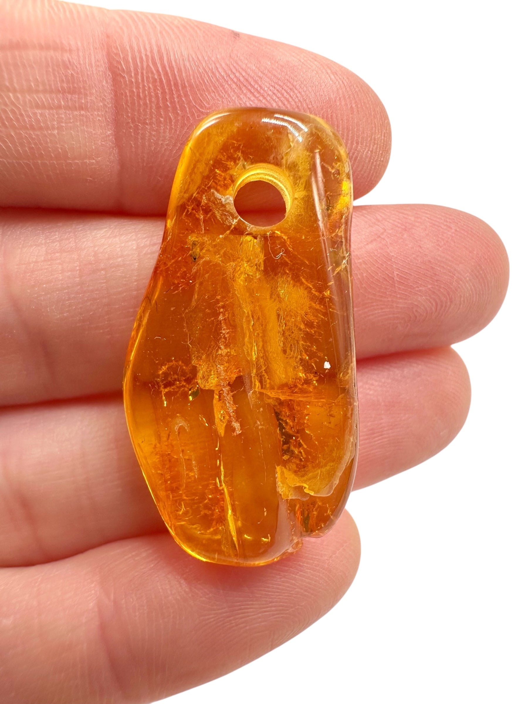 Amber with a drilled hole for hanging 2,3g – Lithuania