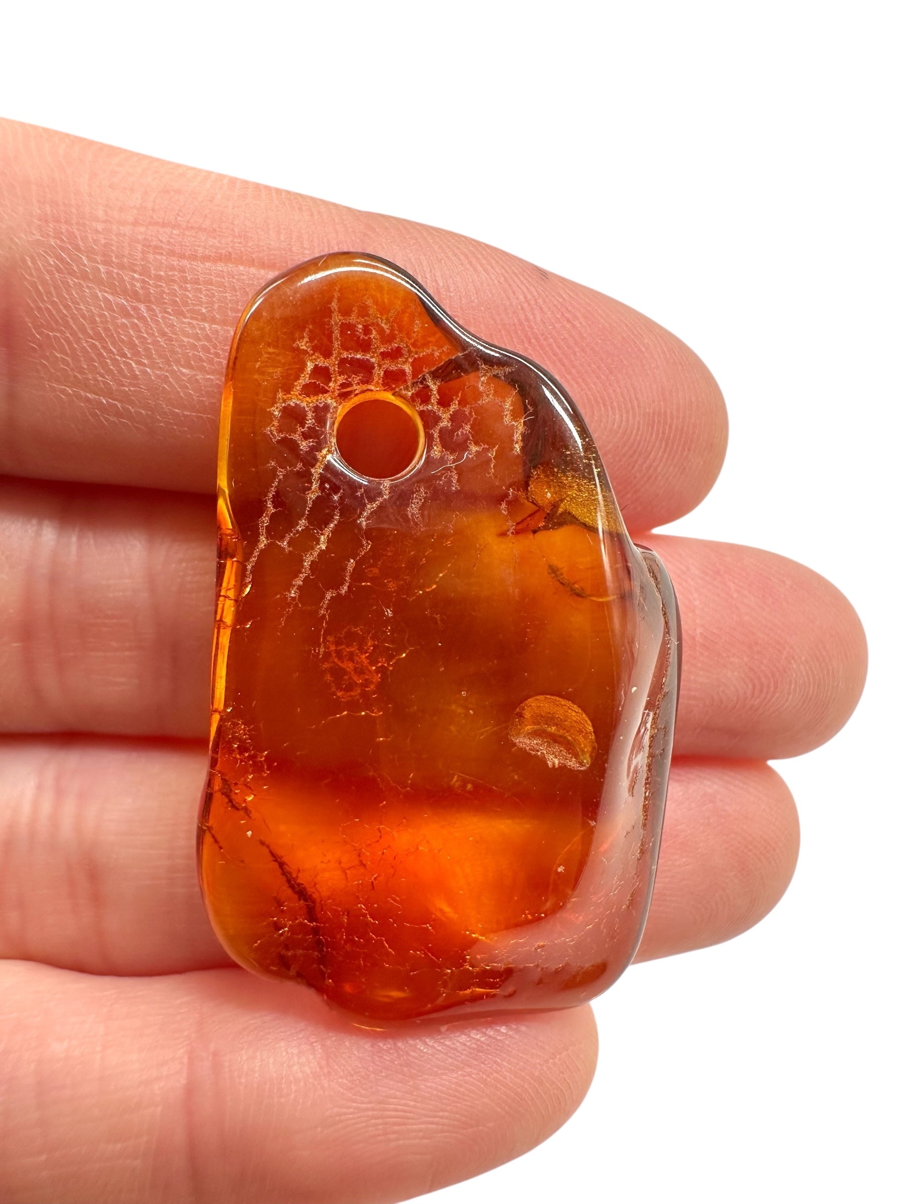 Amber with a drilled hole for hanging 4g – Lithuania