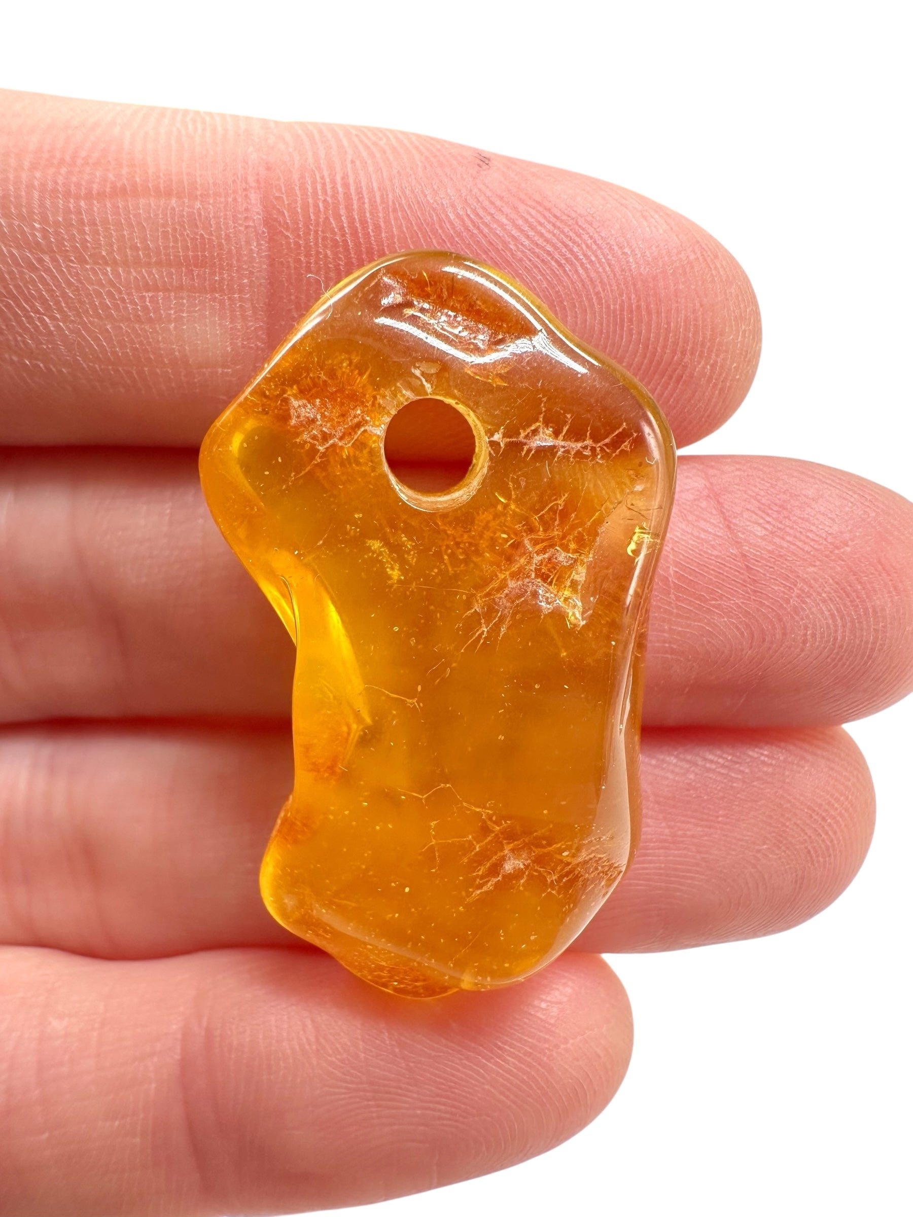 Amber with a drilled hole for hanging 2,7g – Lithuania