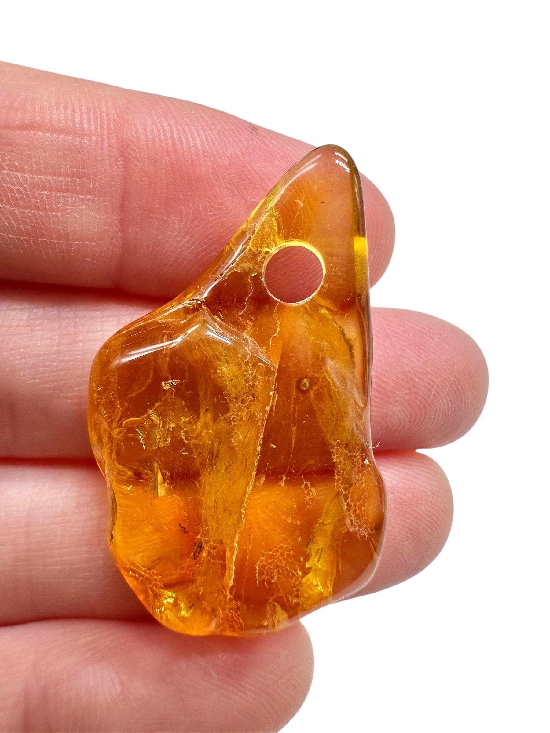 Amber with a drilled hole for hanging 2,7g – Lithuania - JND154