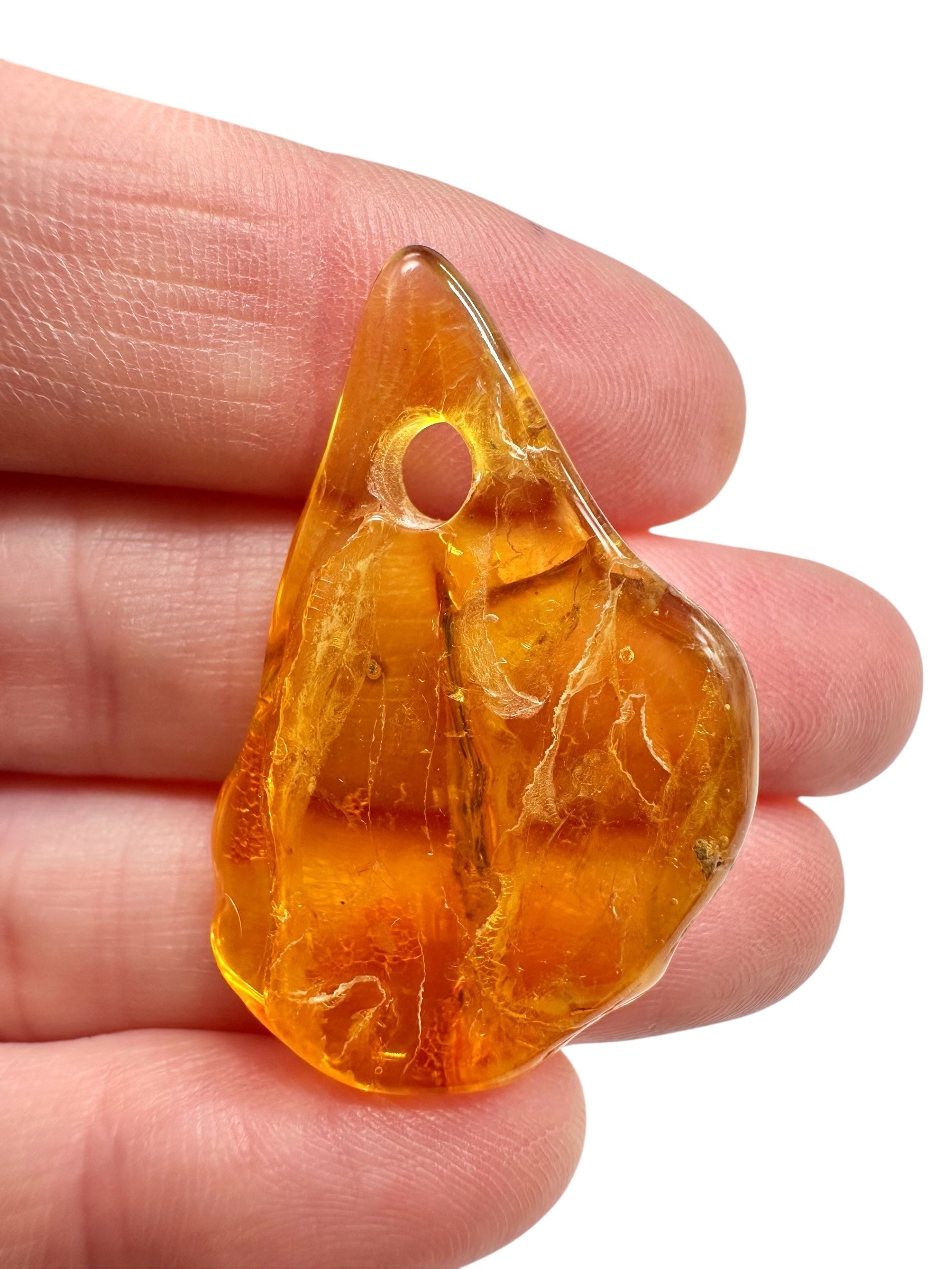 Amber with a drilled hole for hanging 2,7g – Lithuania