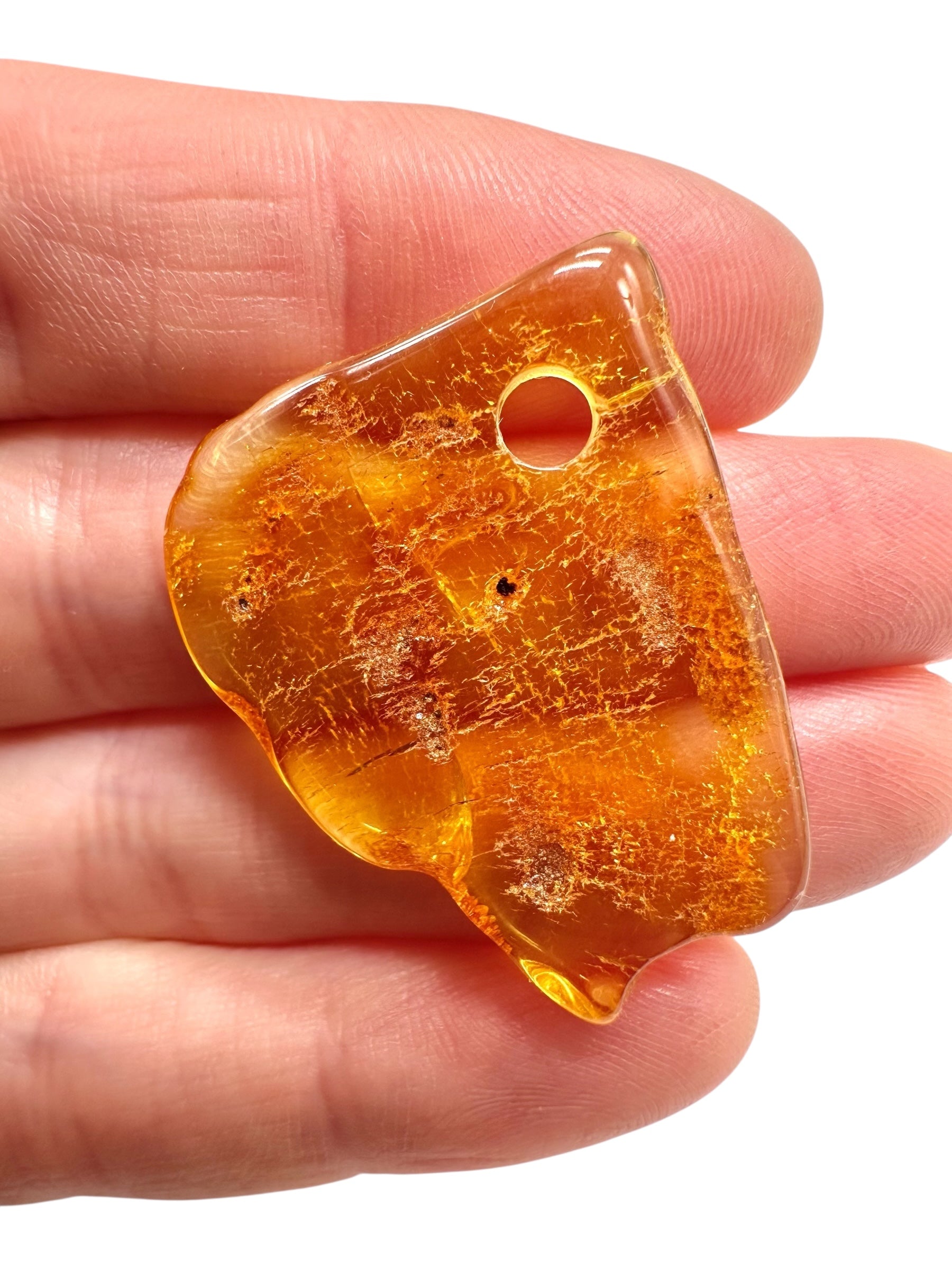 Amber with a drilled hole for hanging 2,4g – Lithuania - JND157