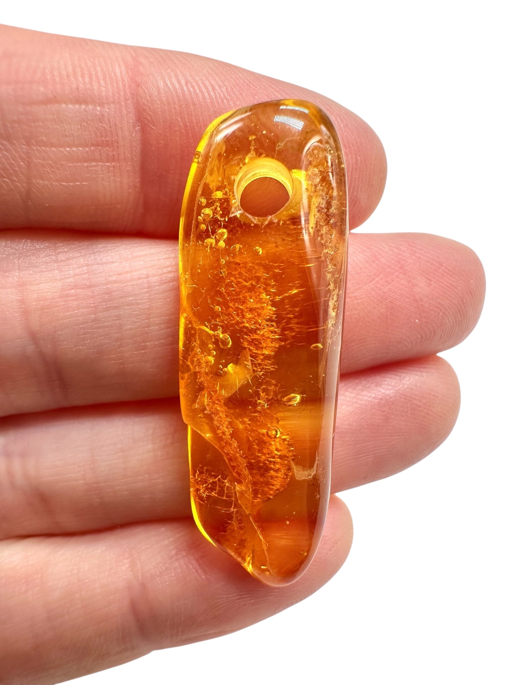 Amber with a drilled hole for hanging 2,1g – Lithuania