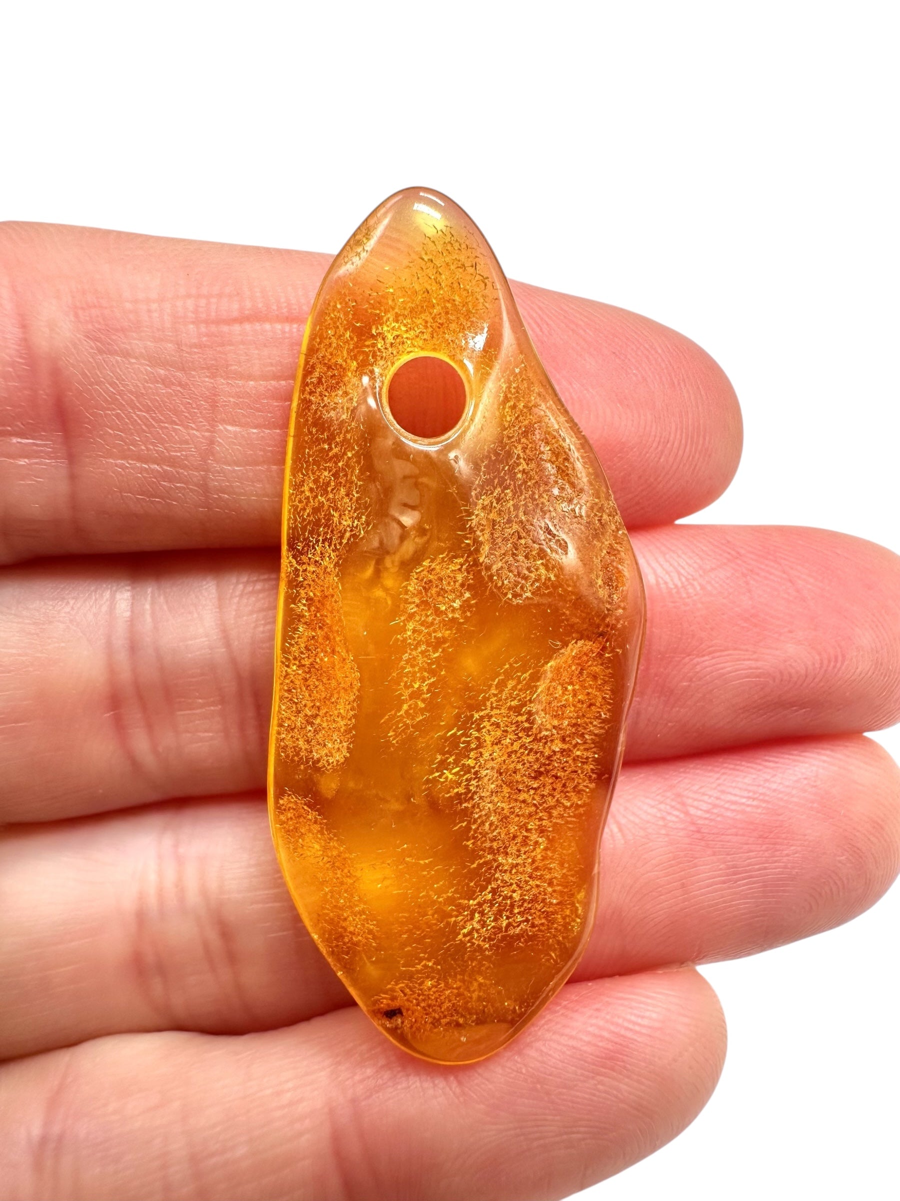 Amber with a drilled hole for hanging 2,6g – Lithuania
