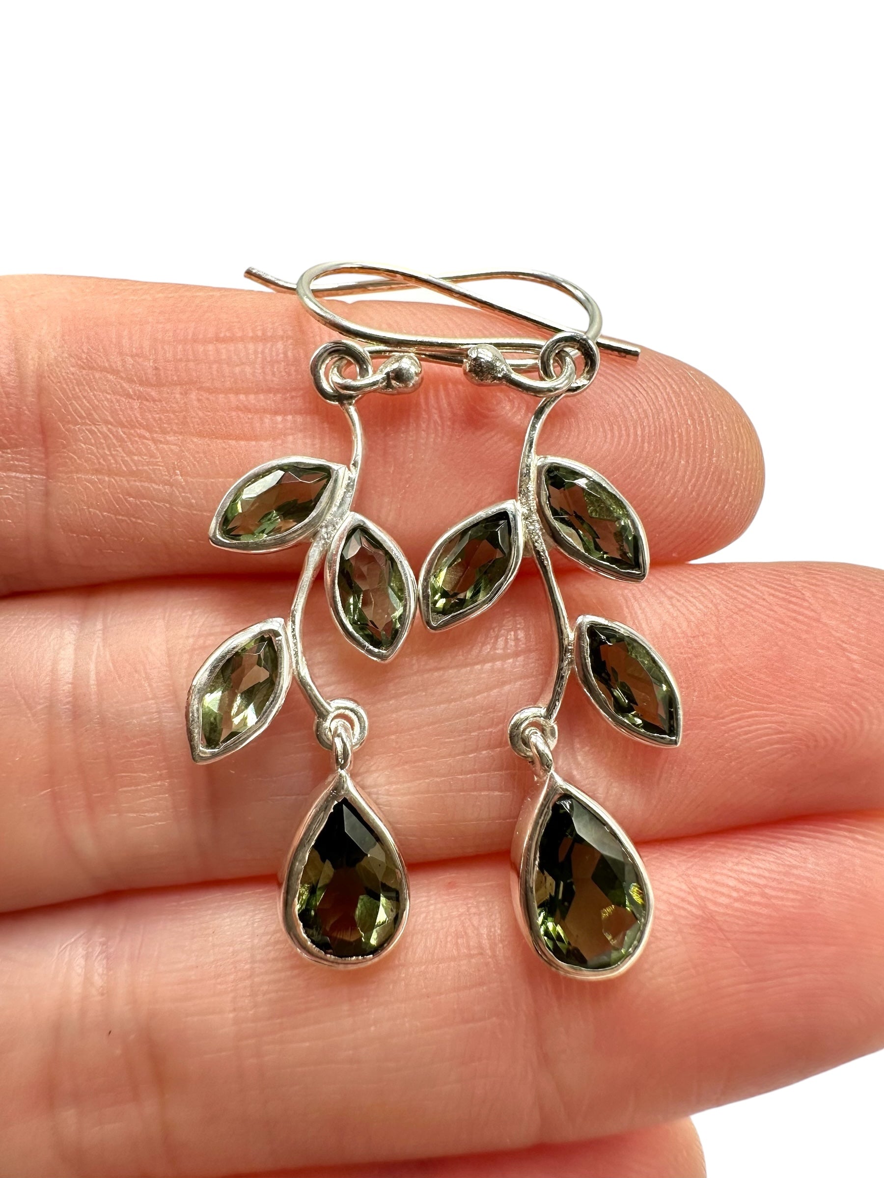 Silver earrings with faceted moldavites