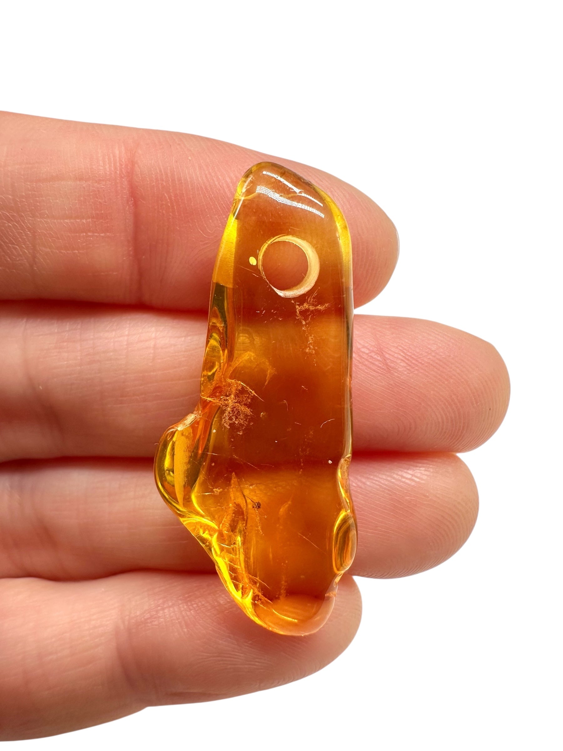 Amber with a drilled hole for hanging 1,9g – Lithuania - JND169
