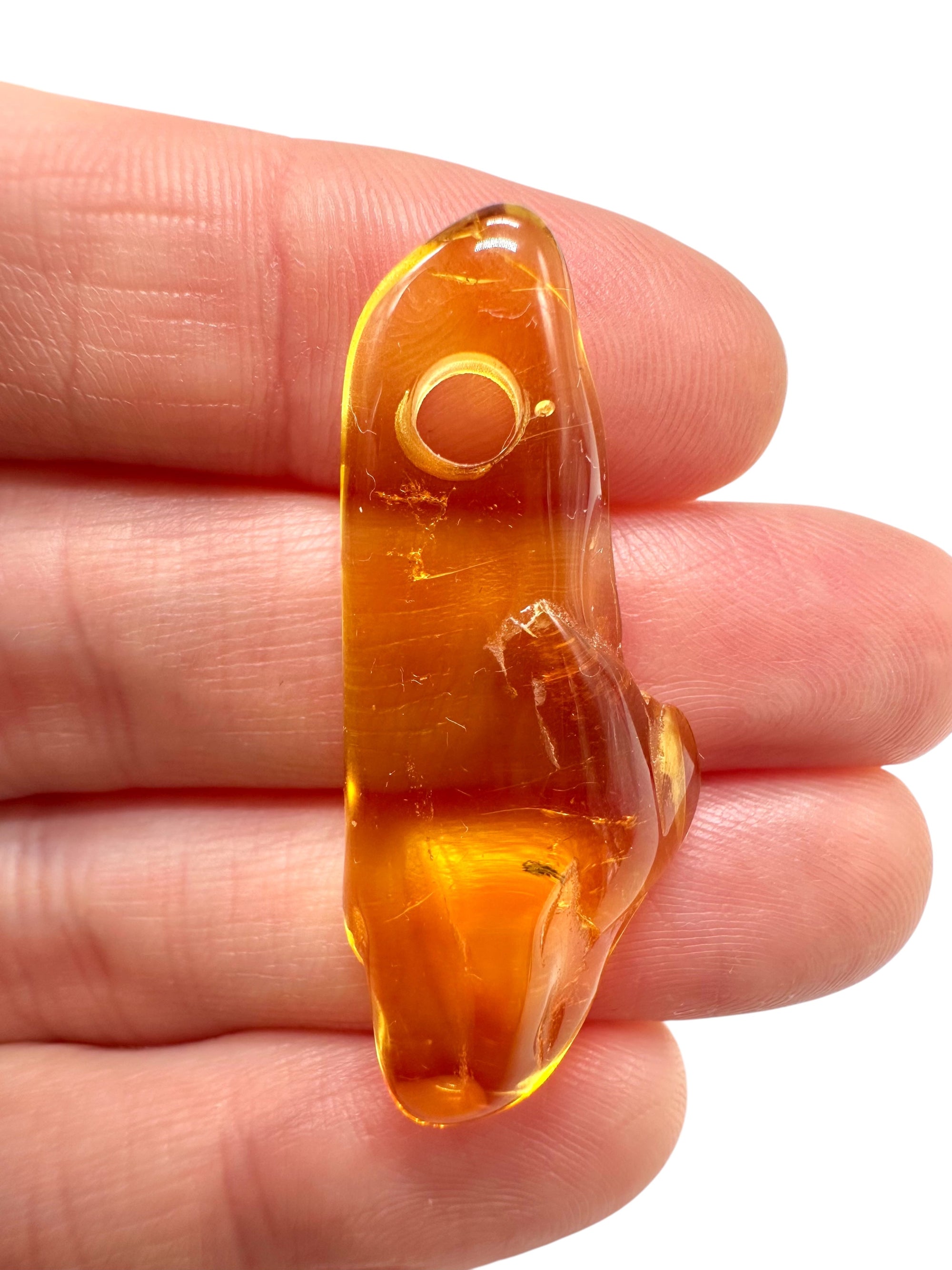 Amber with a drilled hole for hanging 1,9g – Lithuania