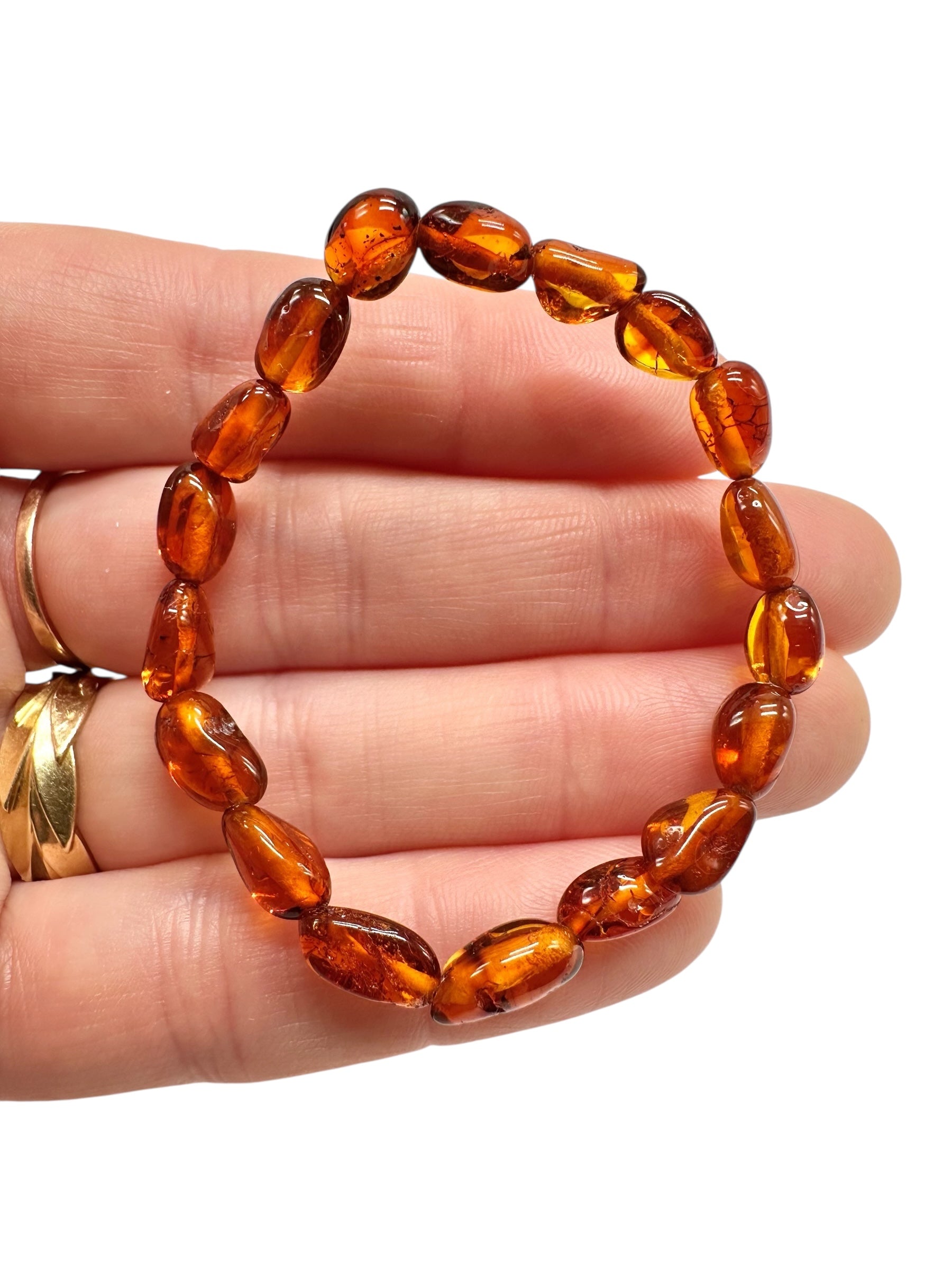 Children's bracelet made of polished genuine amber spheres / dark – random piece