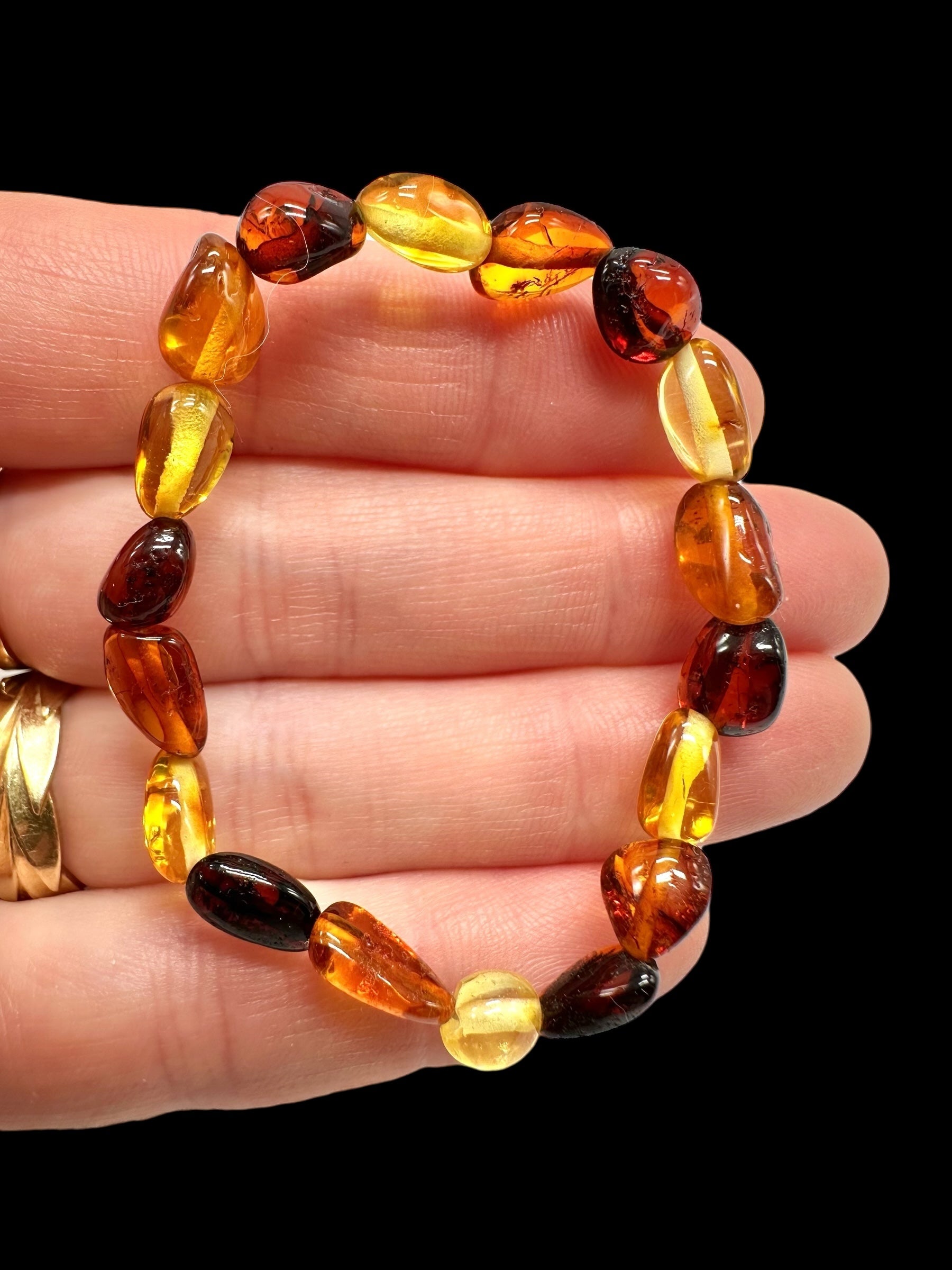 Children's bracelet made of polished genuine amber spheres / mix – random piece