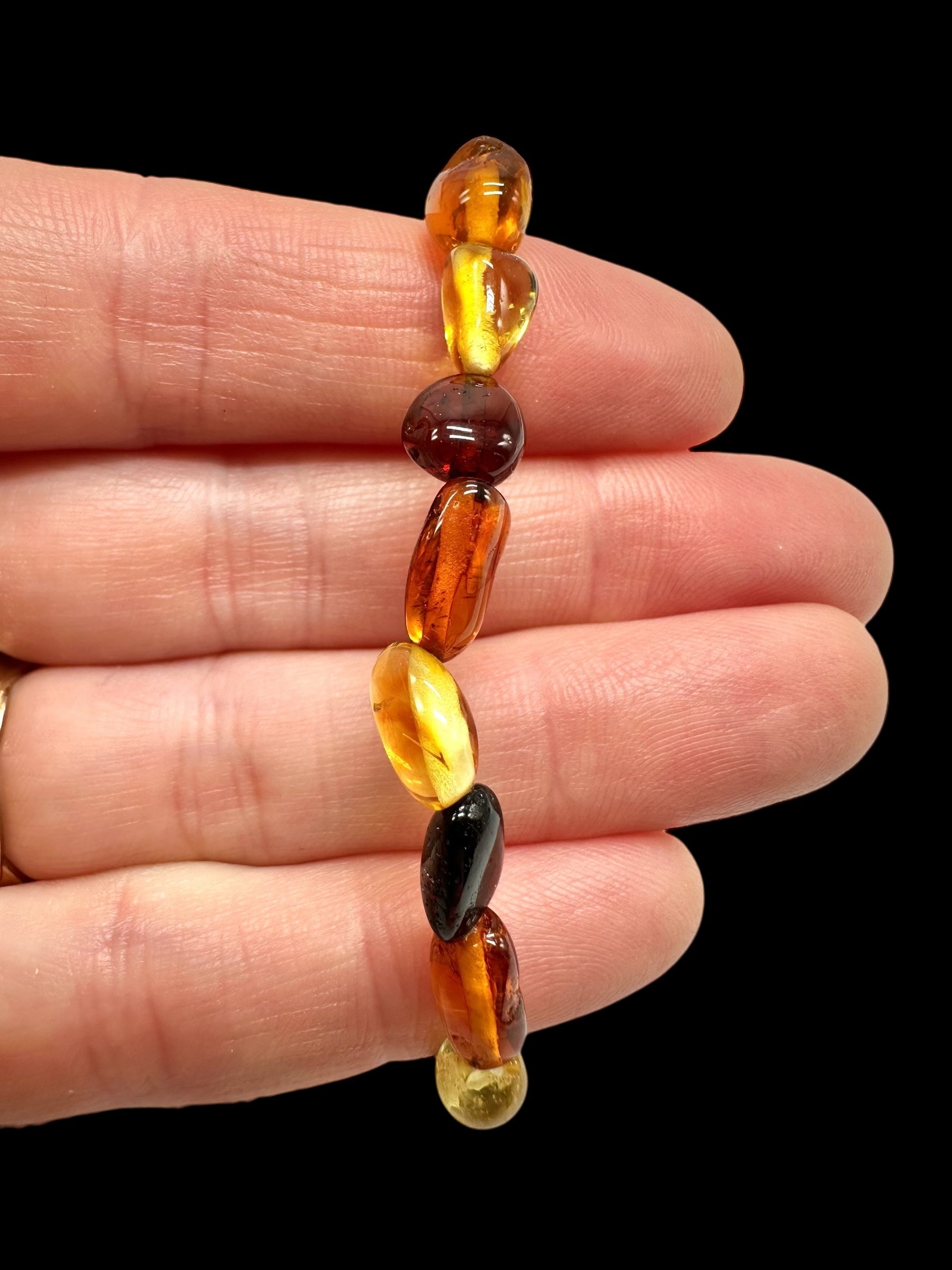 Children's bracelet made of polished genuine amber spheres / mix – random piece - N/J018