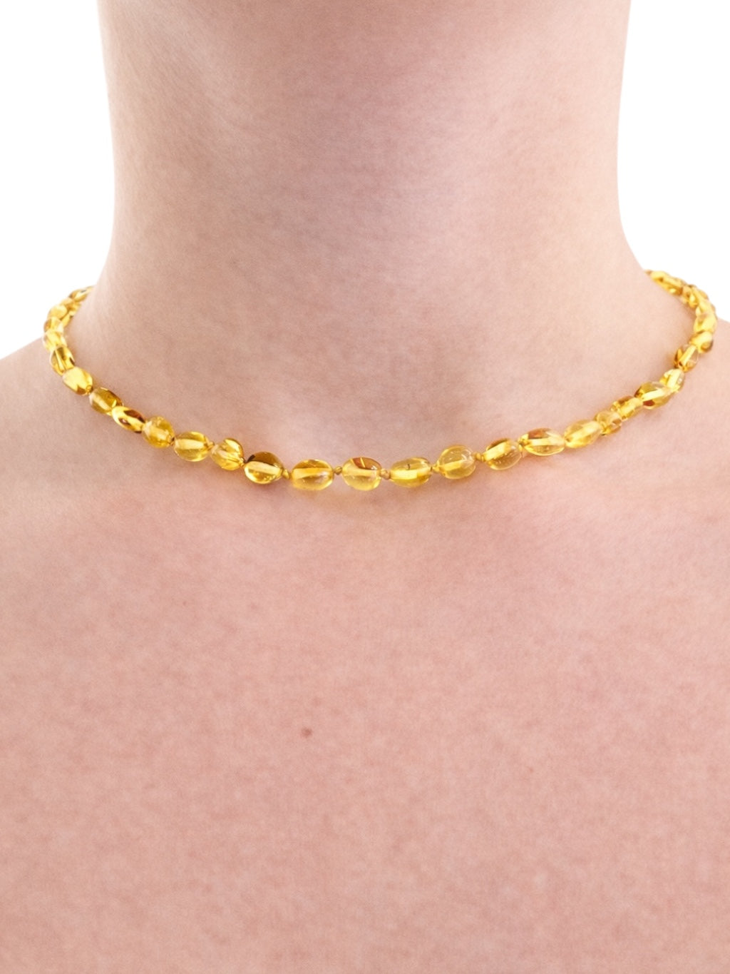Children's necklace made of polished genuine amber spheres / light – random piece