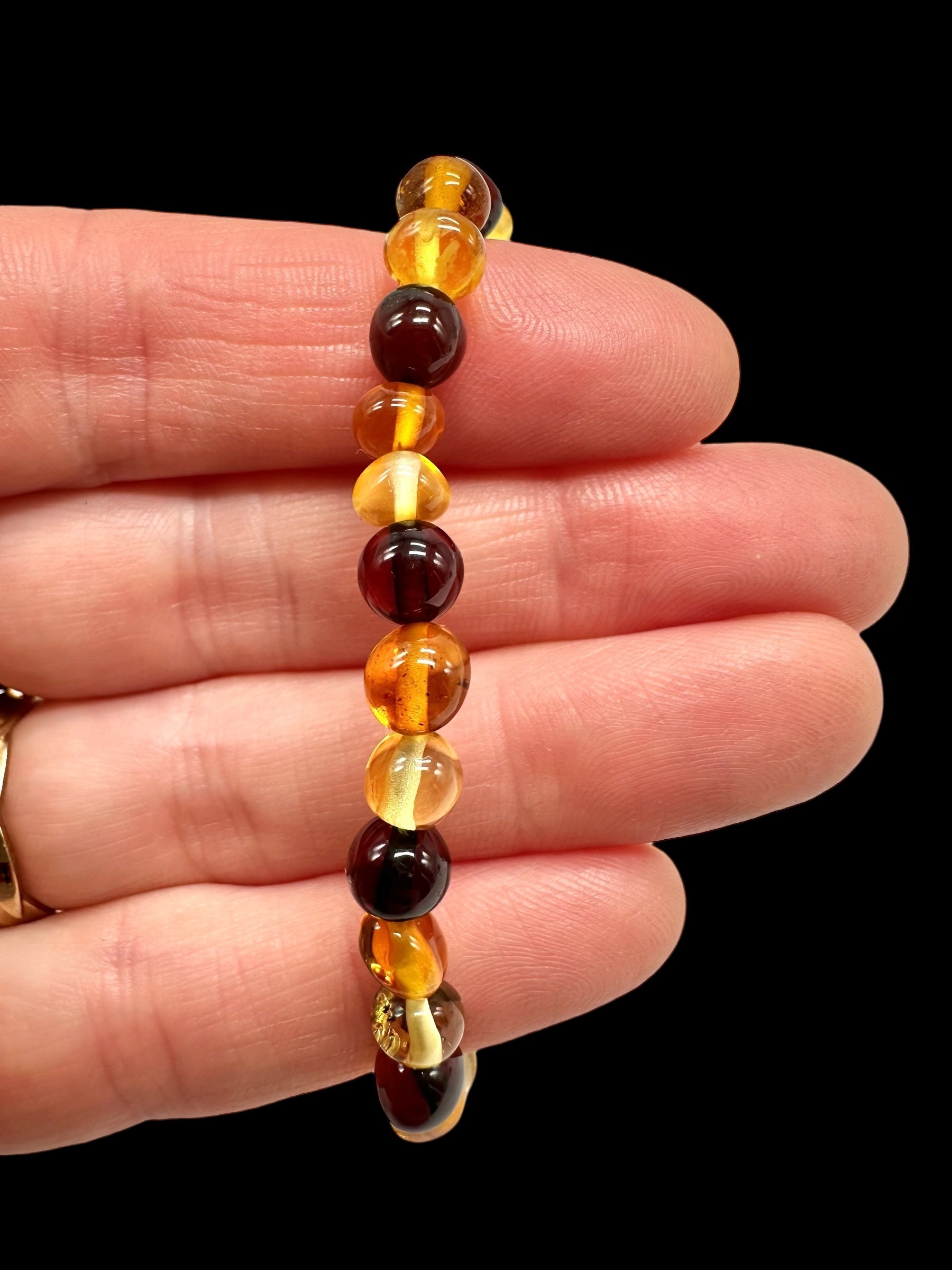 Children's bracelet made of polished genuine amber spheres / mix – random piece - N/J022
