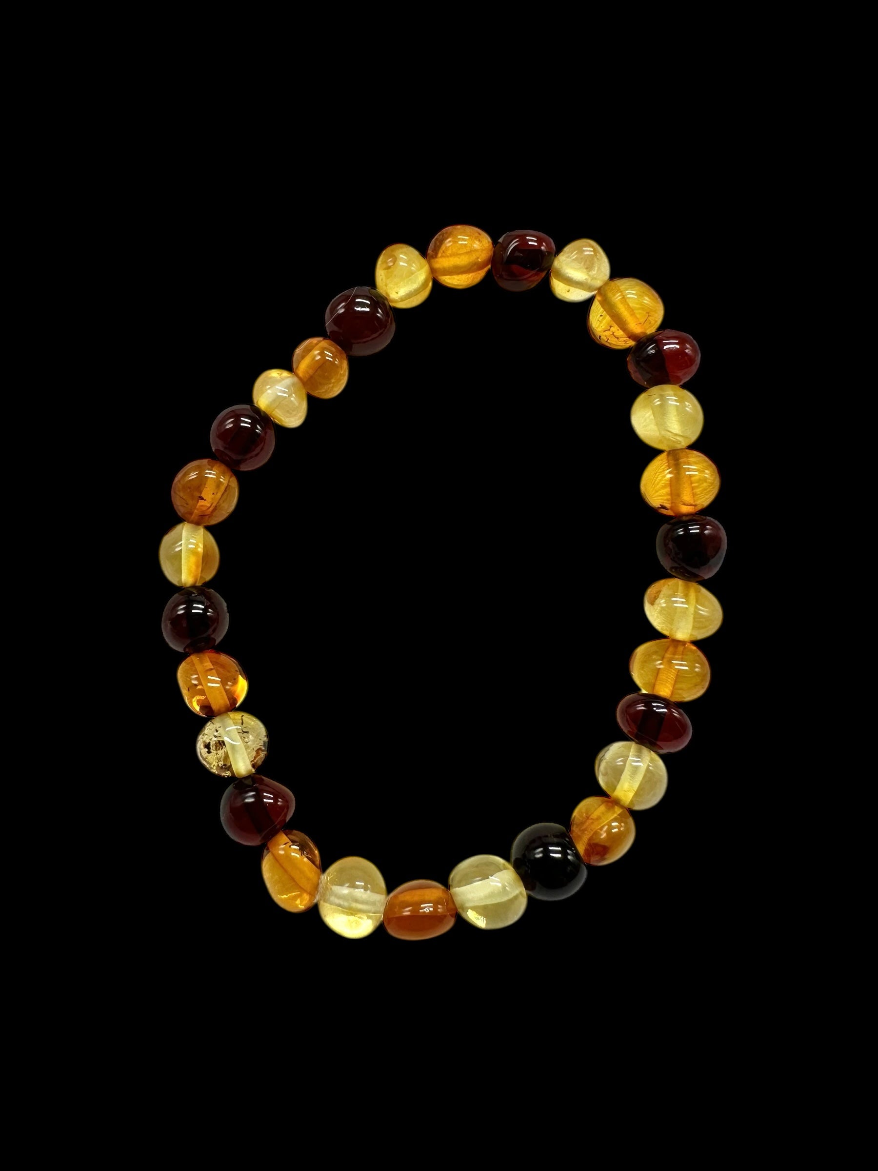 Children's bracelet made of polished genuine amber spheres / mix – random piece - N/J022