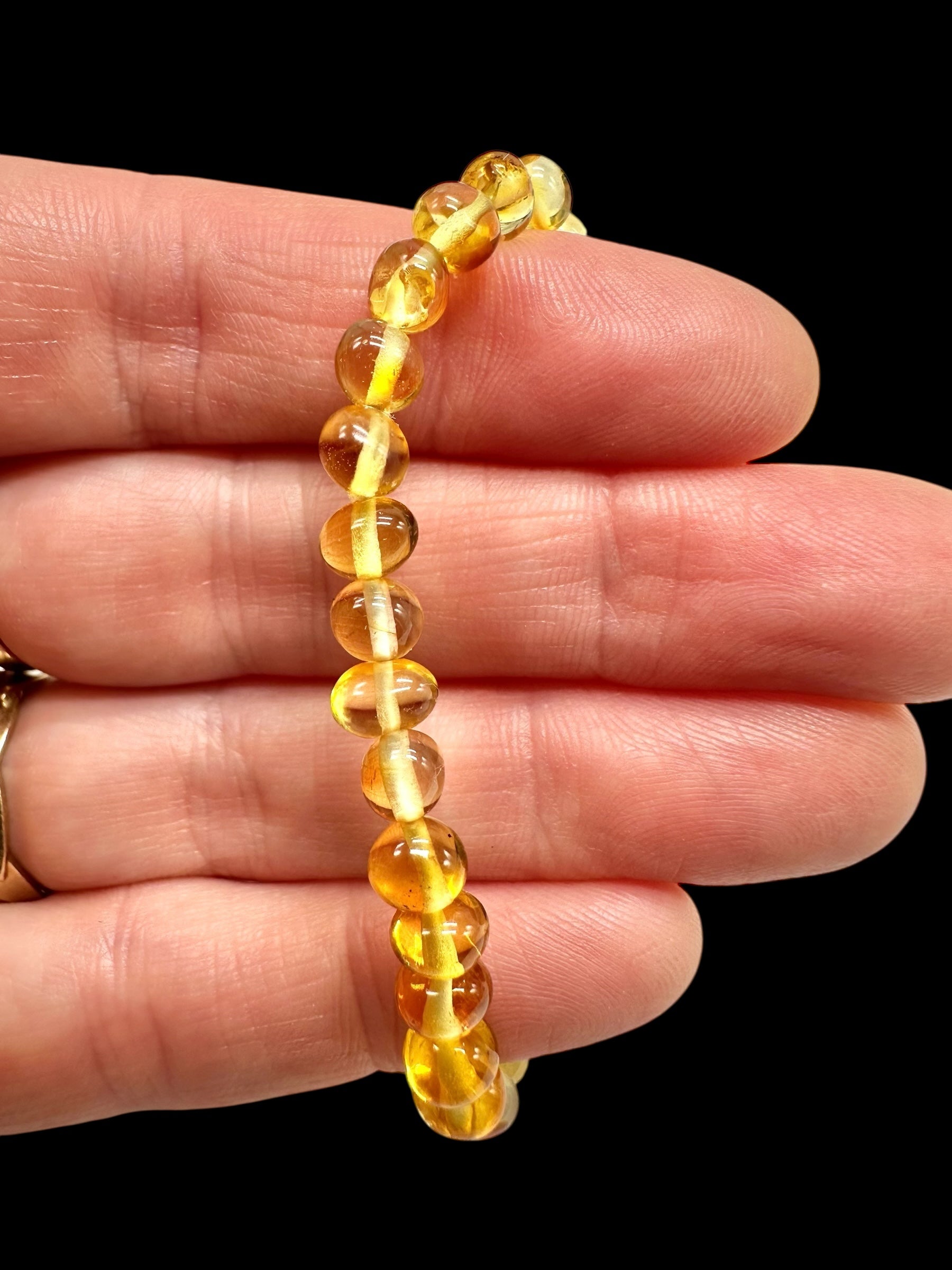 Children's bracelet made of polished genuine amber spheres / light – random piece - N/J023