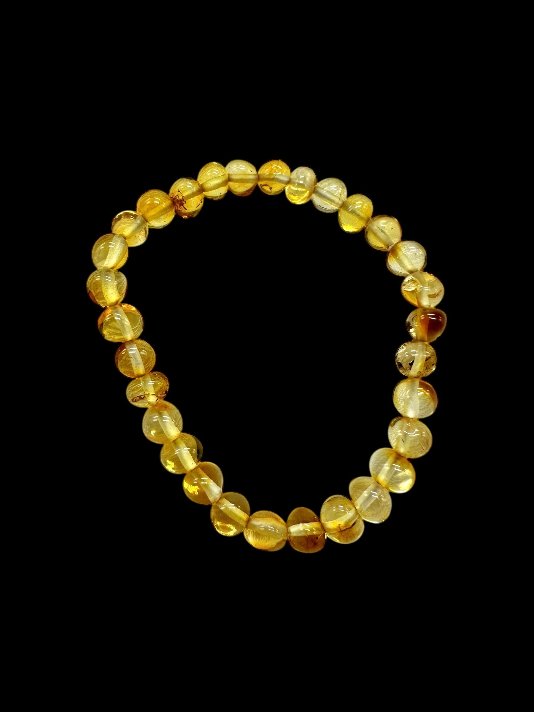 Children's bracelet made of polished genuine amber spheres / light – random piece - N/J023