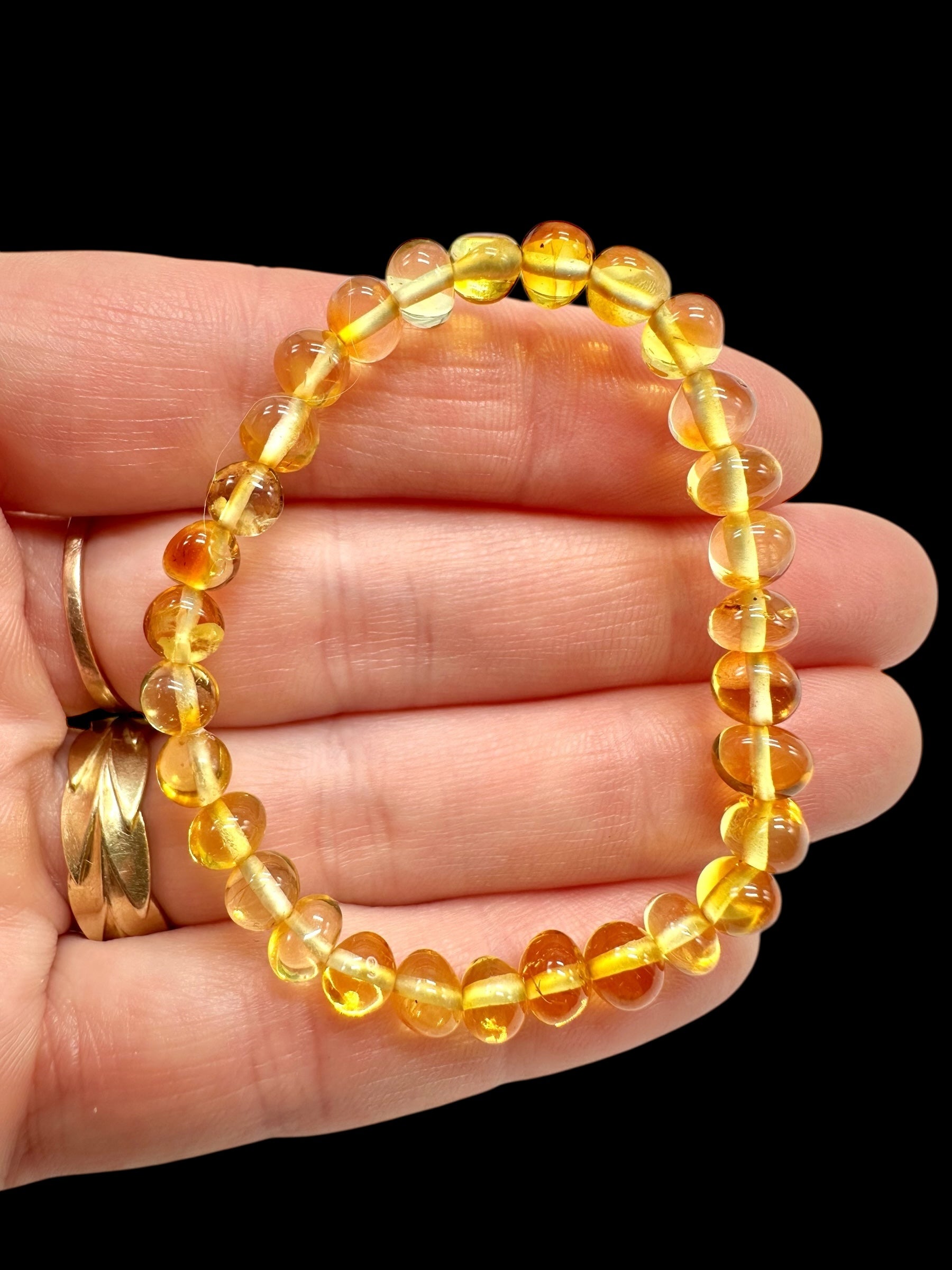 Children's bracelet made of polished genuine amber spheres / light – random piece