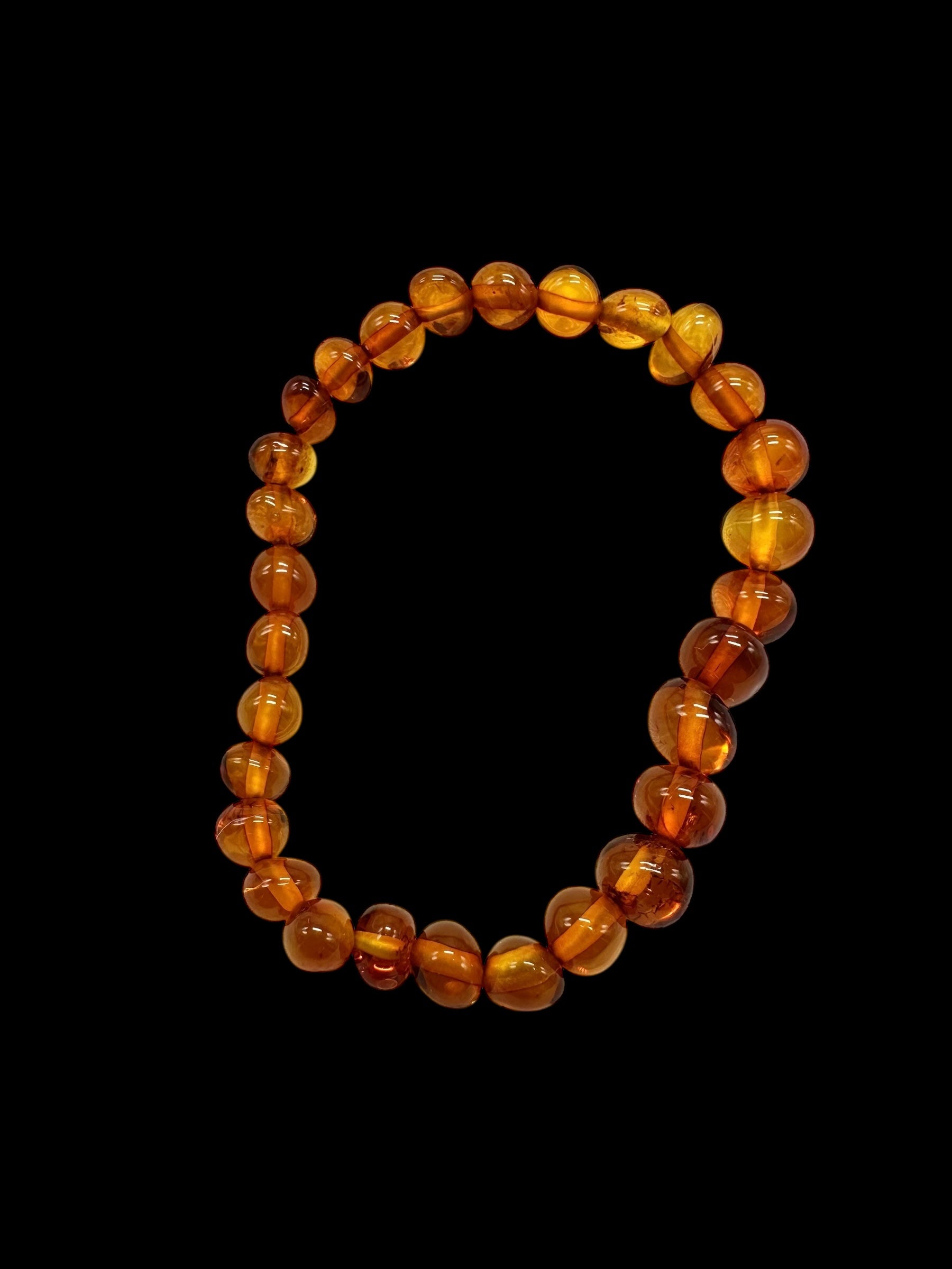 Children's bracelet made of polished genuine amber spheres / dark – random piece - N/J024