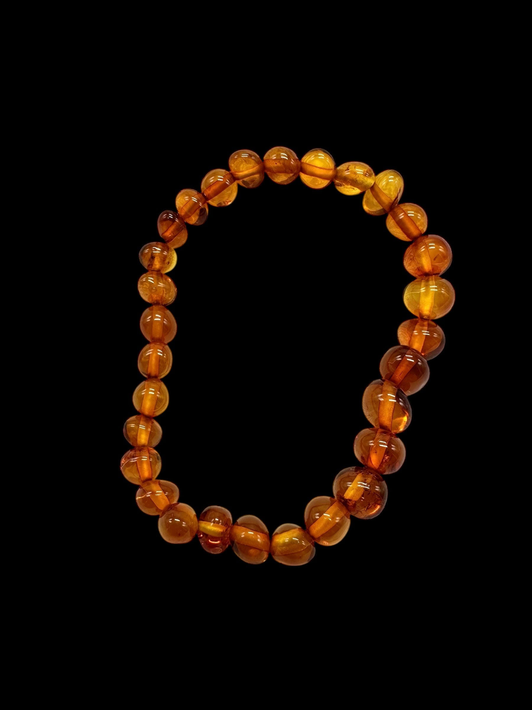 Children's bracelet made of polished genuine amber spheres / dark – random piece - N/J024