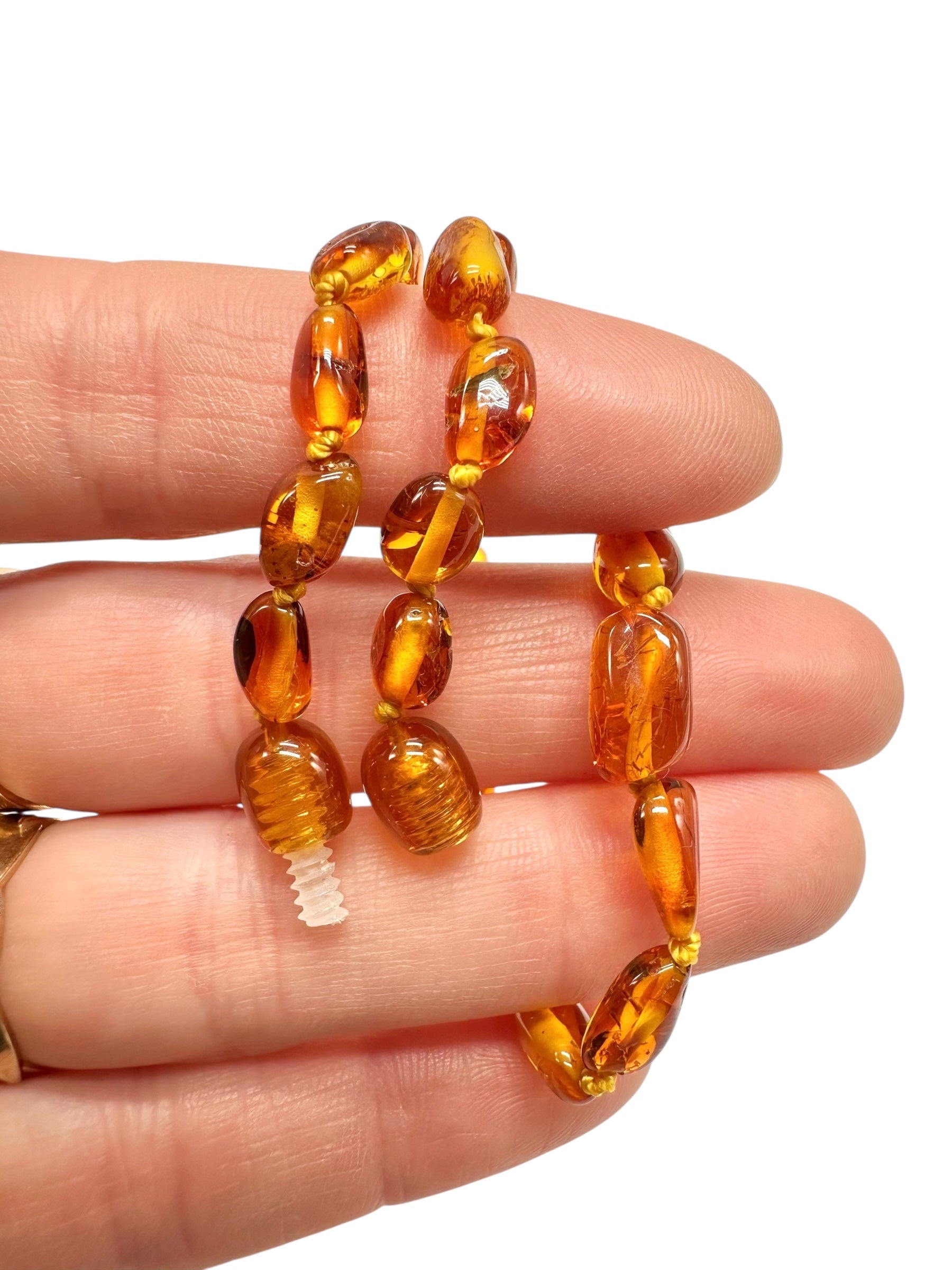 Children's necklace made of polished genuine amber spheres / dark – random piece - NA/J002