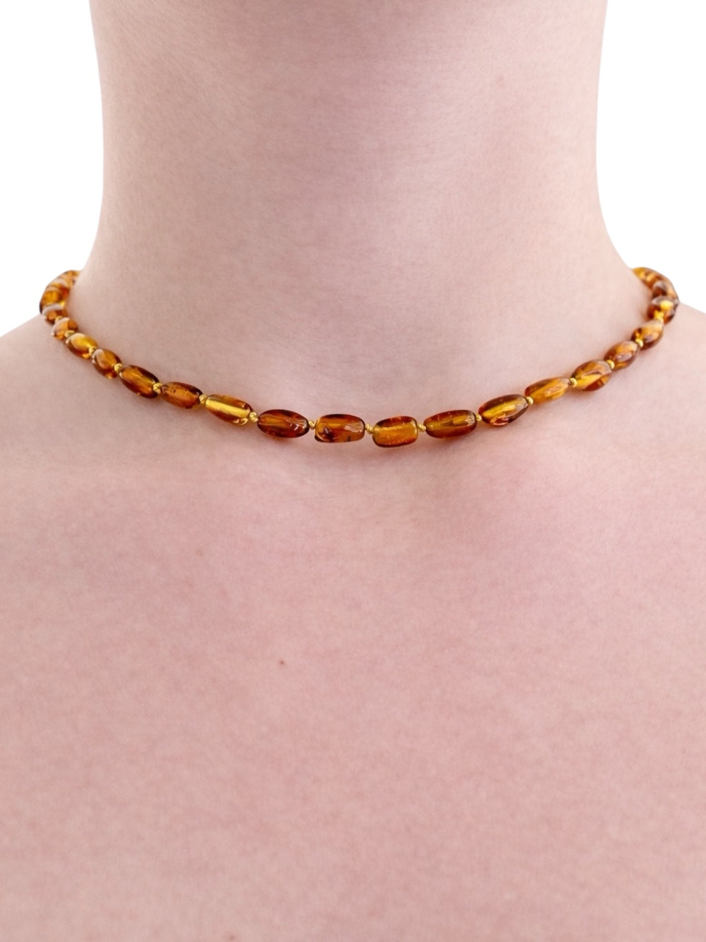 Children's necklace made of polished genuine amber spheres / dark – random piece