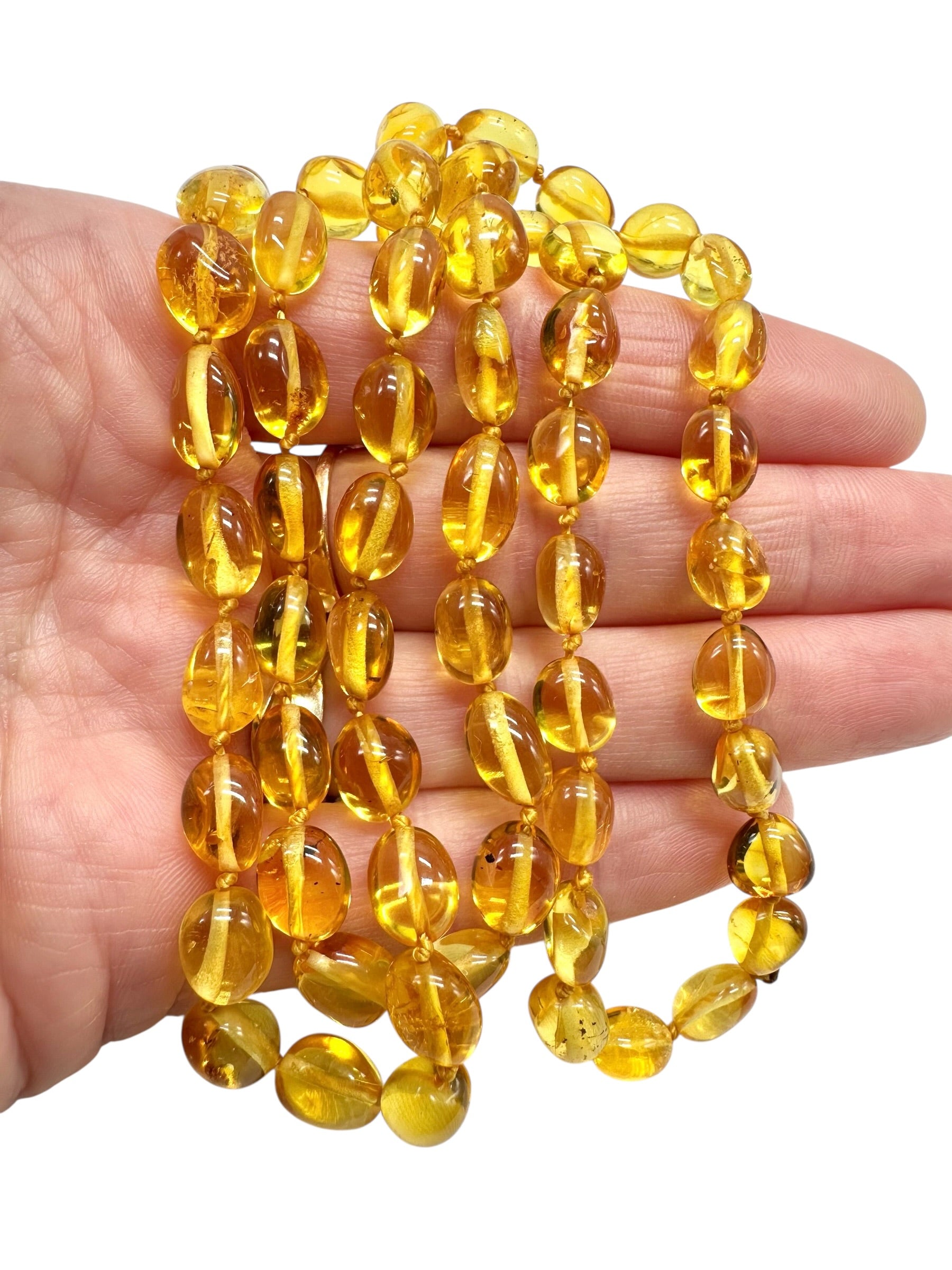 Necklace made of polished genuine amber spheres / light – random piece - NA/J010