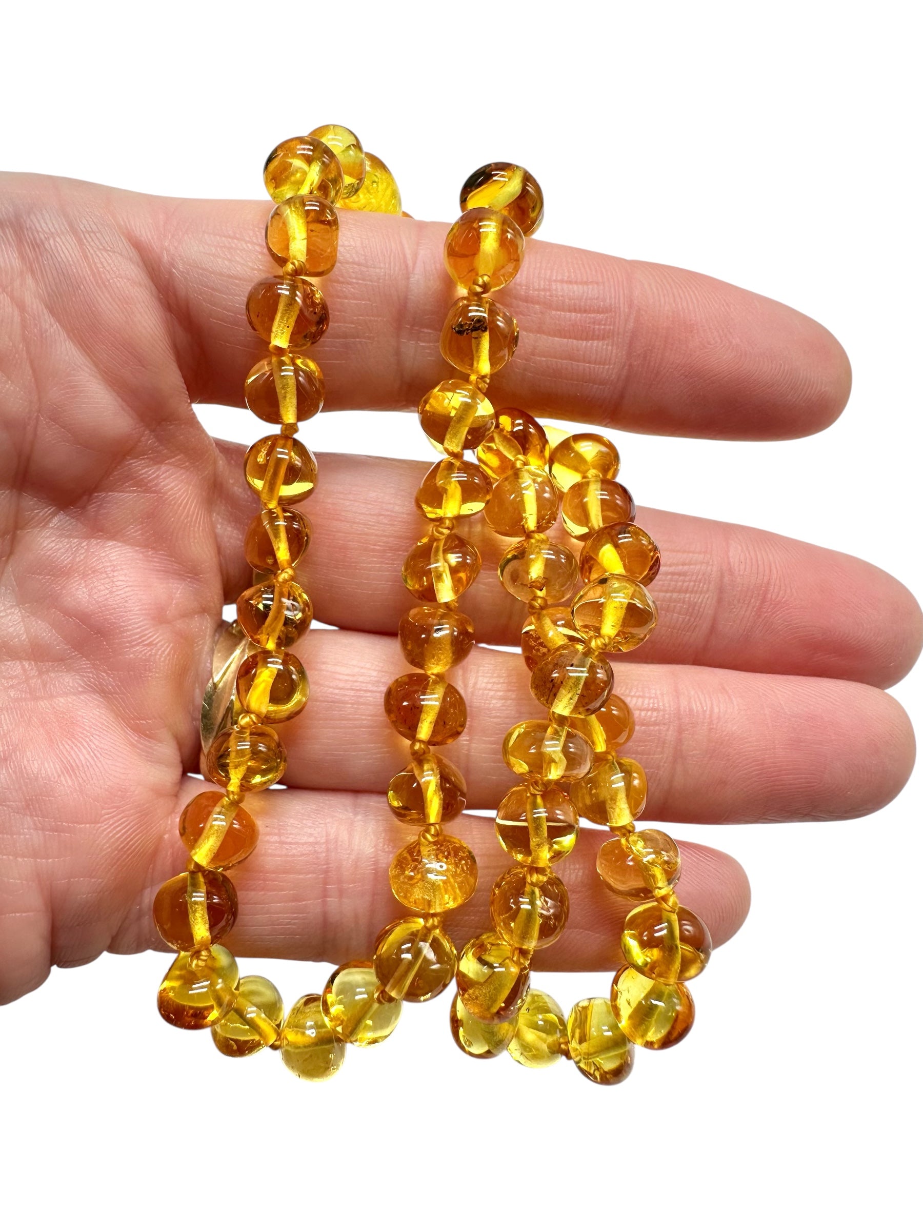 Necklace made of polished genuine amber spheres / light – random piece - NA/J015