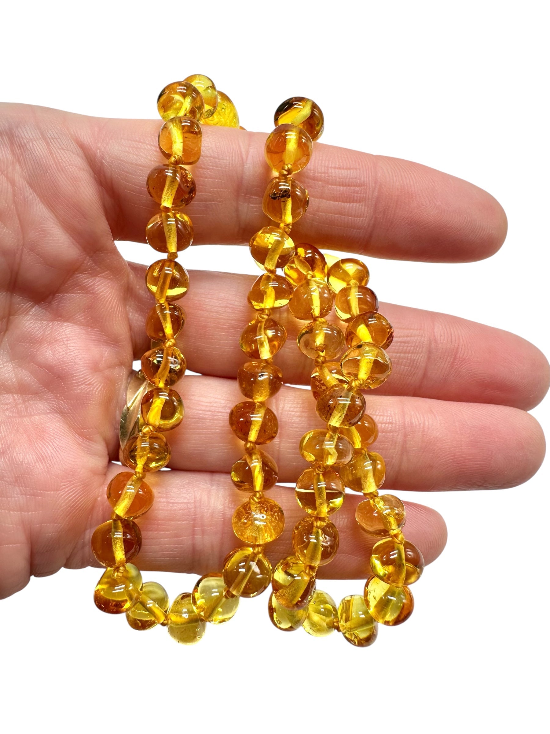 Necklace made of polished genuine amber spheres / light – random piece - NA/J015