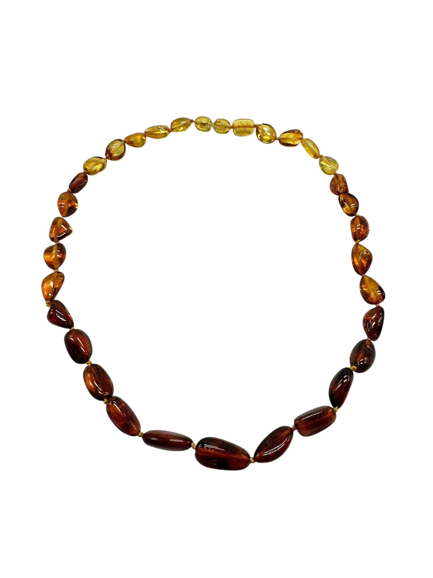 Necklace made of polished genuine amber spheres / mix – random piece