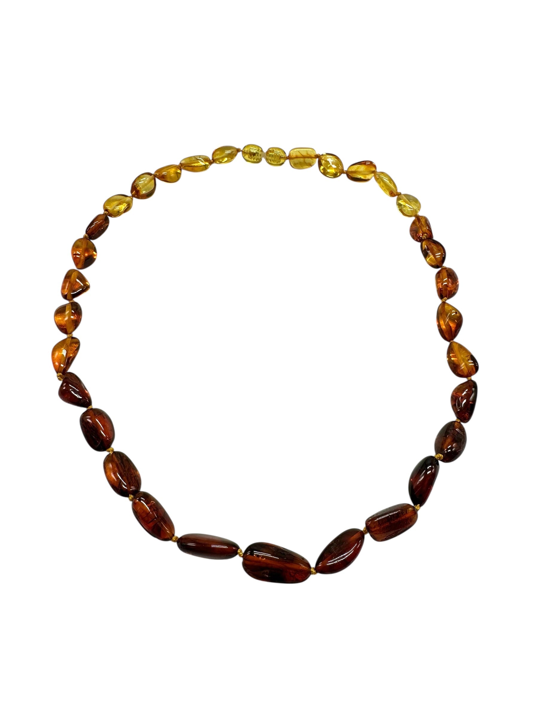 Necklace made of polished genuine amber spheres / mix – random piece