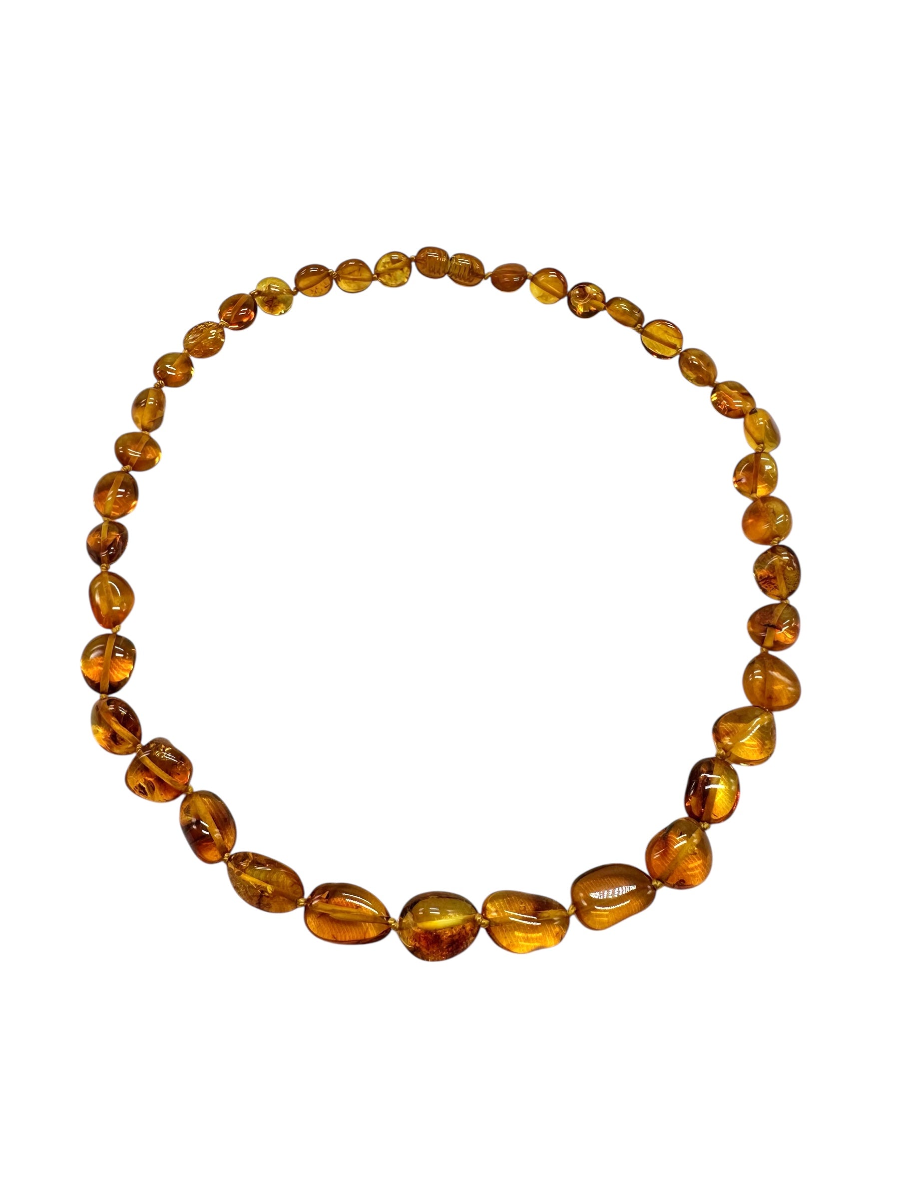 Necklace made of polished genuine amber spheres / dark – random piece