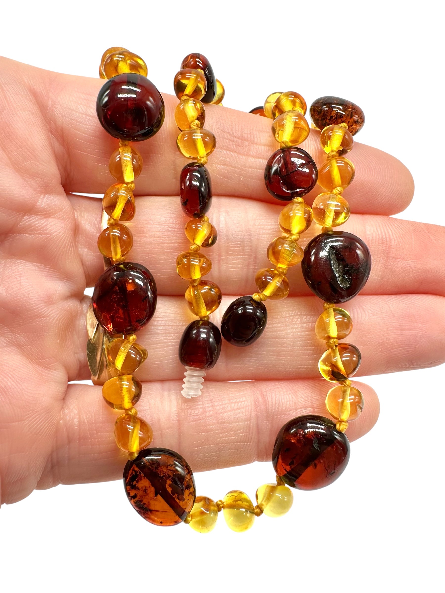 Necklace made of polished genuine amber spheres with insects / mix - NA/J023
