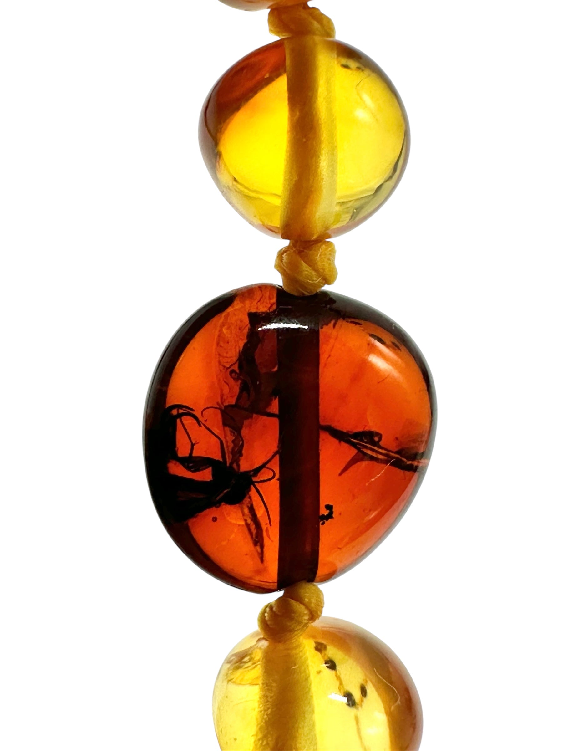 Necklace made of polished genuine amber spheres with insects / mix - NA/J023