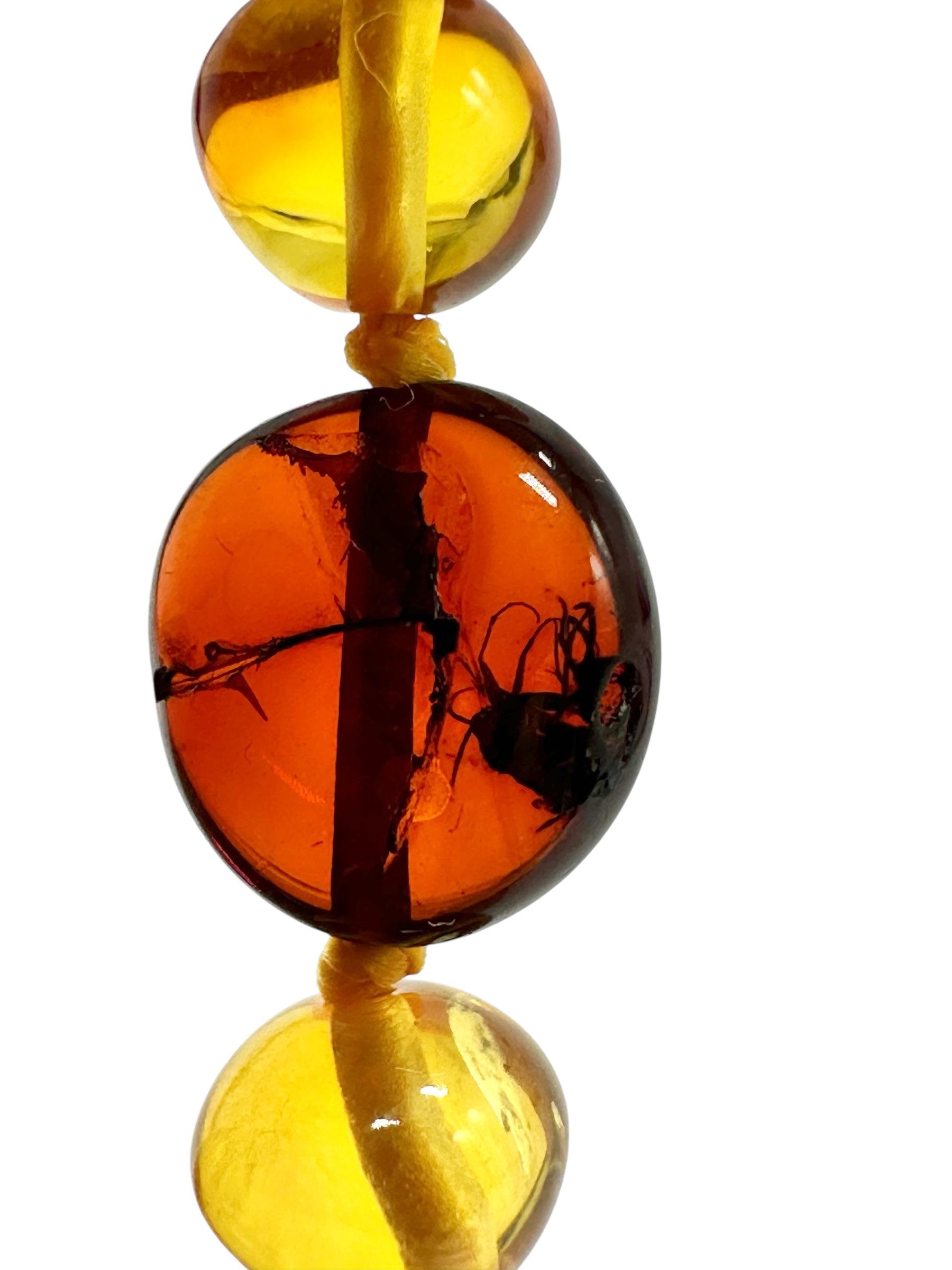 Necklace made of polished genuine amber spheres with insects / mix - NA/J023